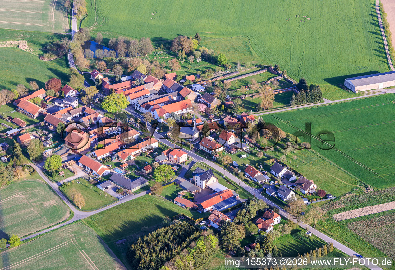 Village view with village church from the west in the district Bahren in Peuschen in the state Thuringia, Germany
