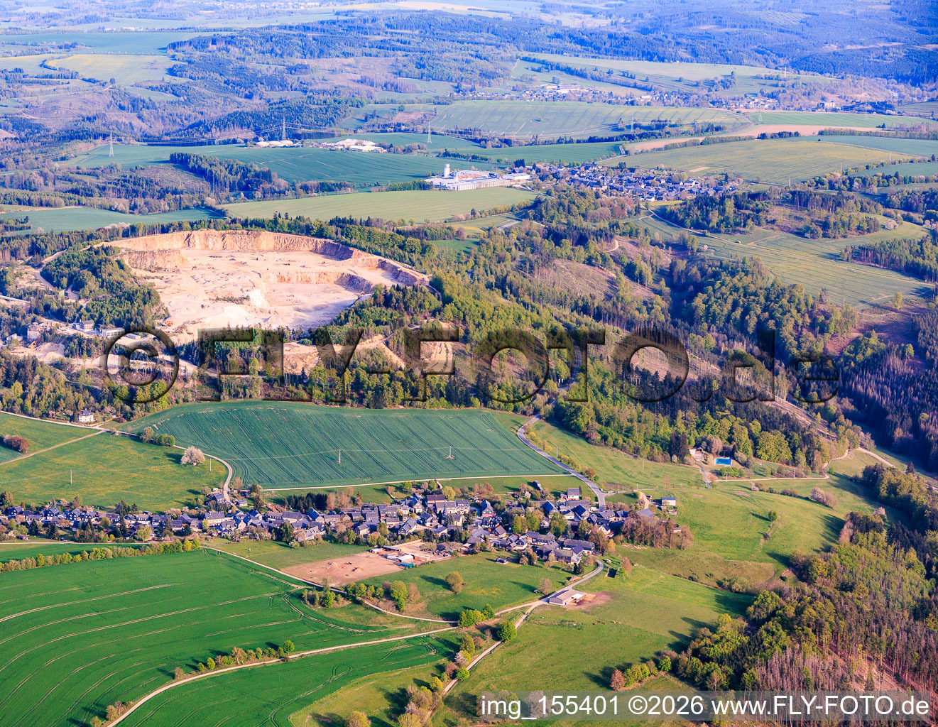 Village view from the northwest in front of the quarry of Granitwerk Fischer GmbH & Co. KG in the district Weitisberga in Wurzbach in the state Thuringia, Germany
