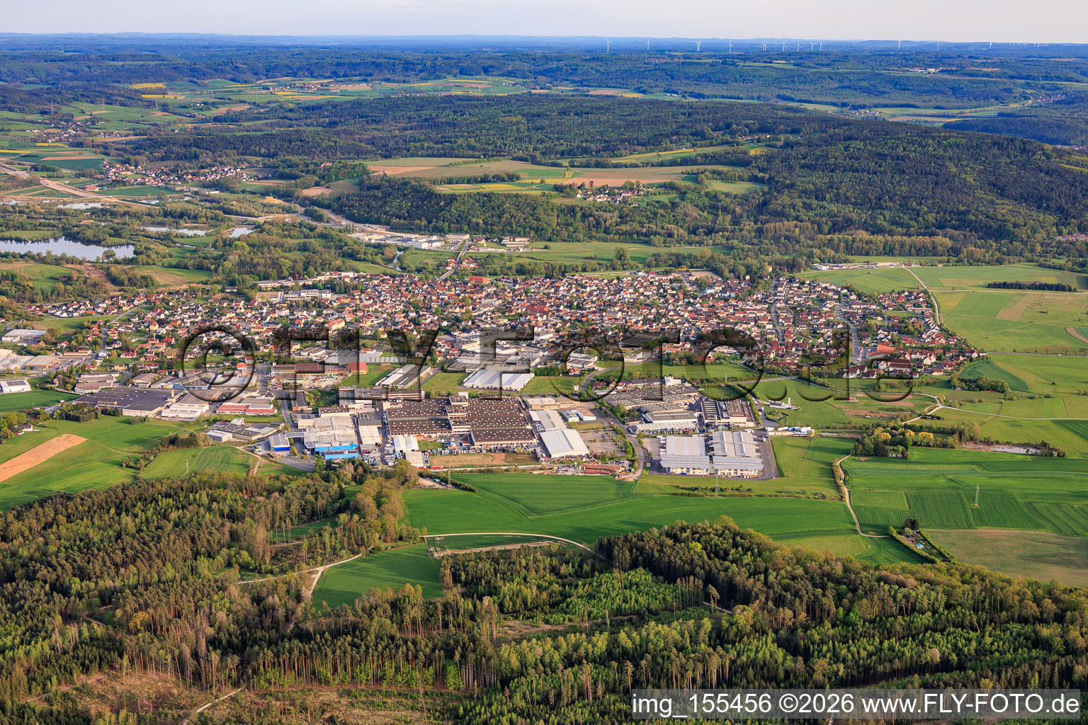View of the town from the north, showing the northern industrial park and SMIA Technology Germany GmbH, Metob Beschichtungen GmbH and Koinor Polstermöbel GmbH & Co. KG. in Michelau in Oberfranken in the state Bavaria, Germany