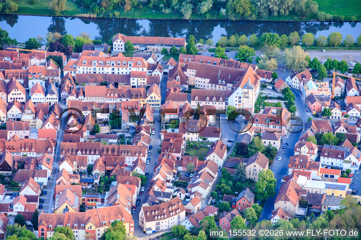 Historic old town on the banks of the Main River with promenade from the north in Haßfurt in the state Bavaria, Germany