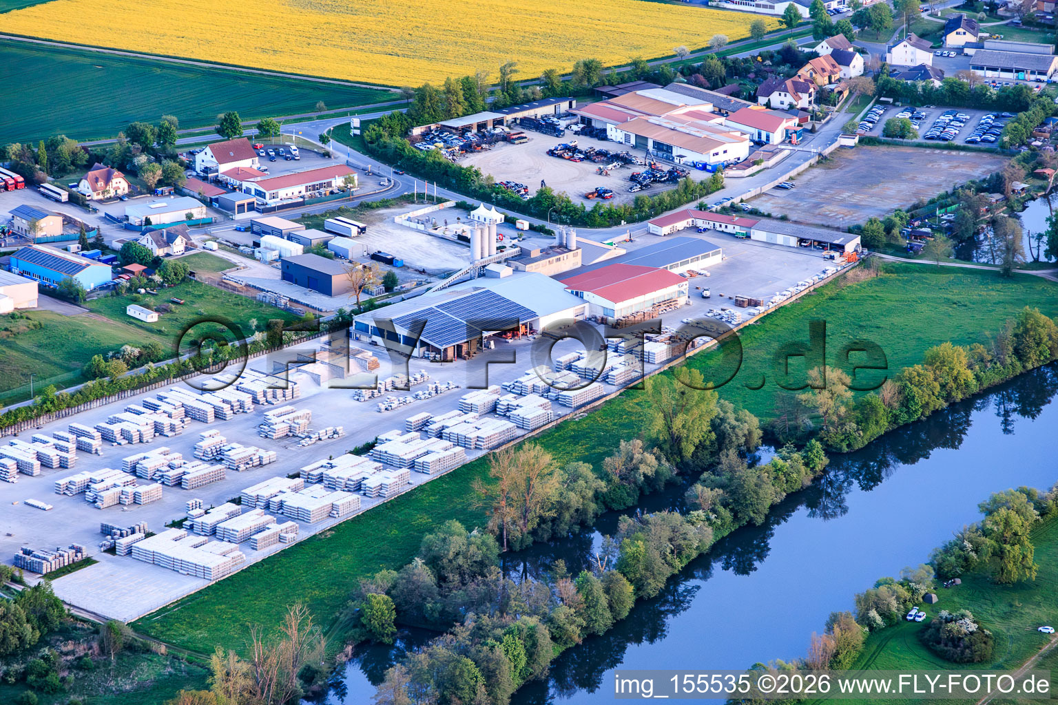 Industrial park on the banks of the Main River with the concrete plant GODELMANN GmbH & Co. KG in Wonfurt in the state Bavaria, Germany