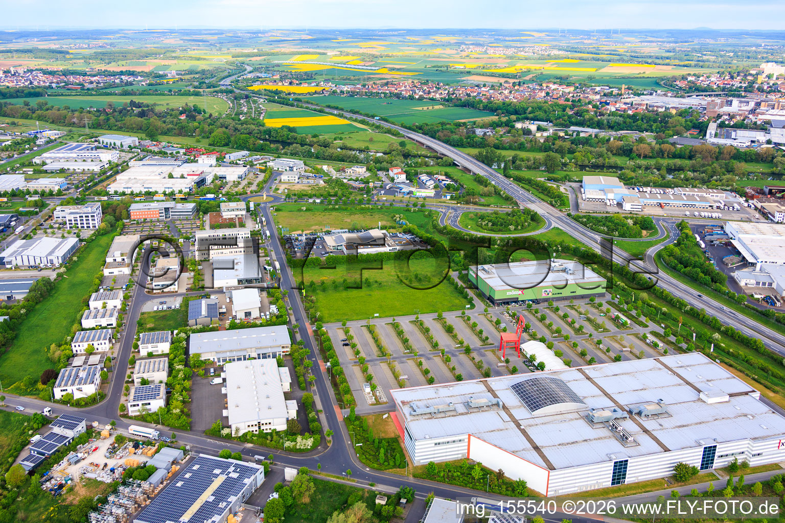 Maintal industrial park with a giant red chair in the parking lot of XXXLutz Neubert Schweinfurt and mömax Schweinfurt in the district Oberndorf in Schweinfurt in the state Bavaria, Germany