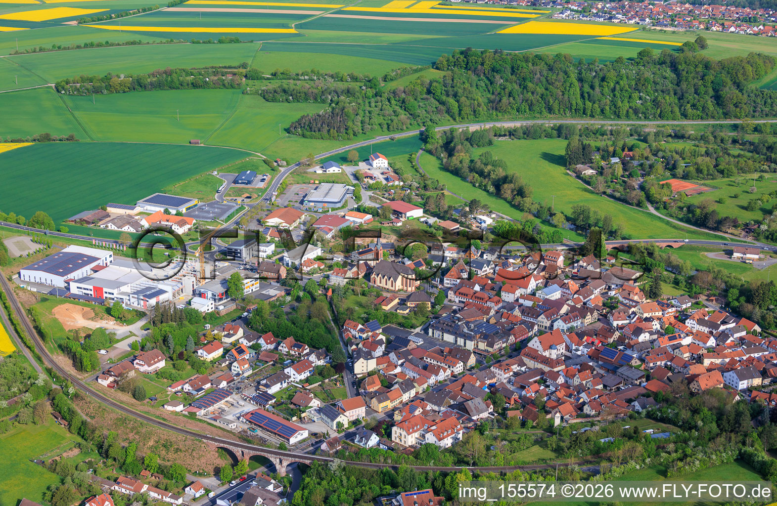 Village view in the Saale valley from the southeast with the church of St. John the Baptist. in Euerdorf in the state Bavaria, Germany