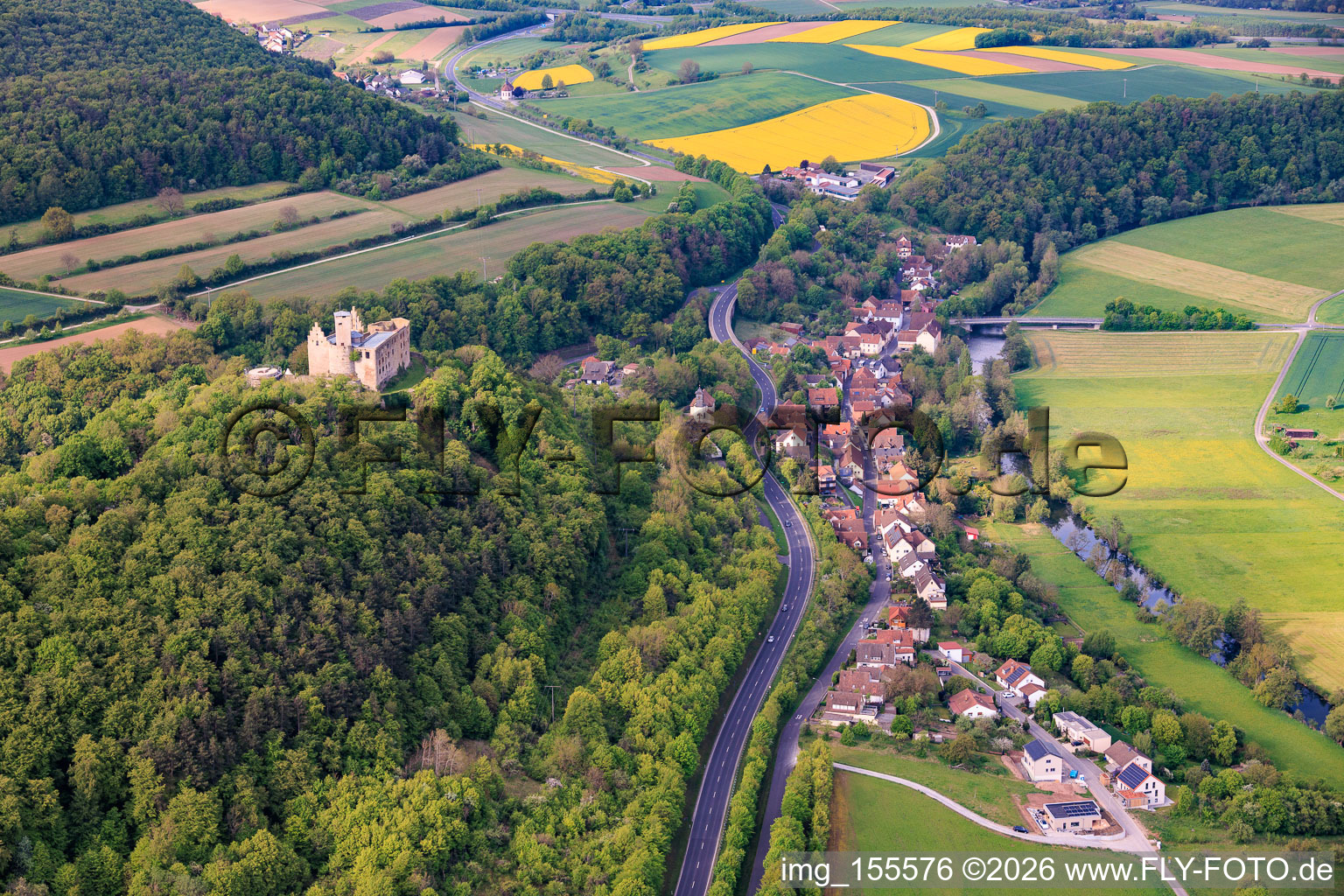 Village view in the valley of the Franconian Saale from the northeast with Trimburg in the district Trimberg in Elfershausen in the state Bavaria, Germany