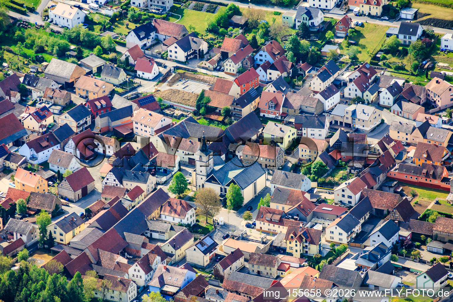 Church square with St. Laurentius Church in the district Gänheim in Arnstein in the state Bavaria, Germany