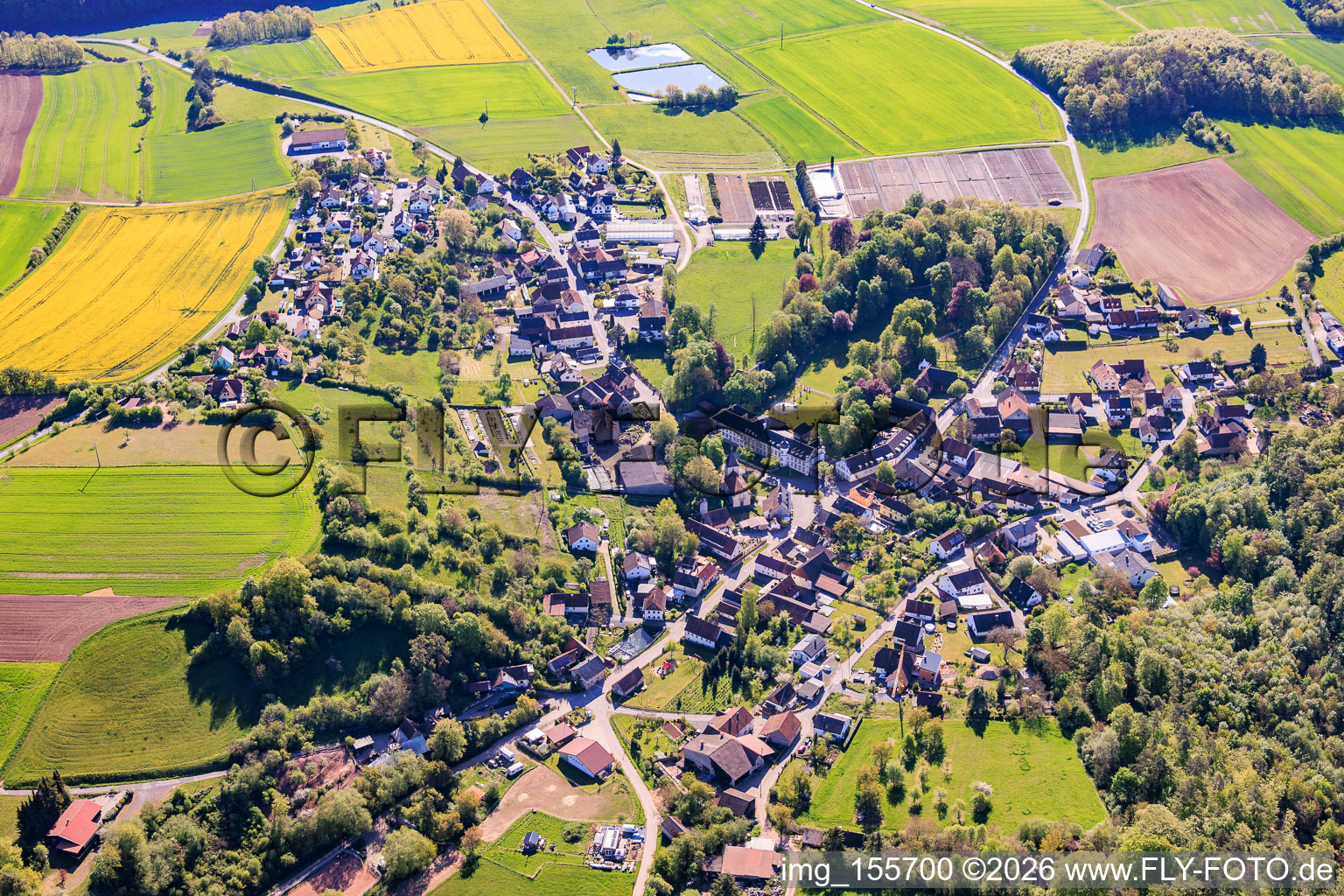Village view from the west with castle Ditterswind (formerly a nursing home for the mentally disabled run by the Diaconal Association, now the private residence of the Fischer family of entrepreneurs) in the district Ditterswind in Maroldsweisach in the state Bavaria, Germany