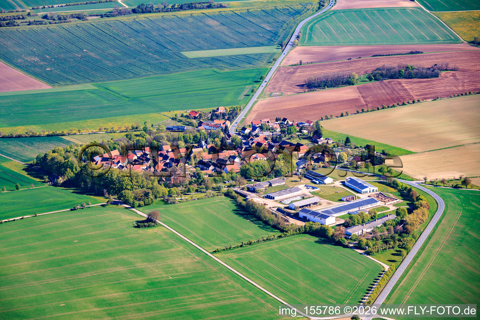 Village view from the east with a large farm in the south on the B85. in the district Neckeroda in Blankenhain in the state Thuringia, Germany