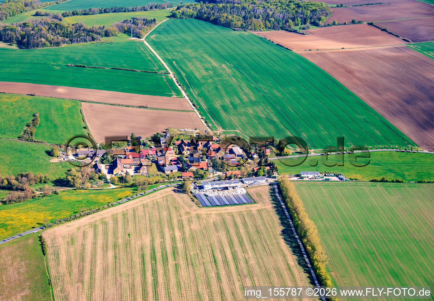 Village view from the east with a large farm in the south on the B85. in the district Neckeroda in Blankenhain in the state Thuringia, Germany