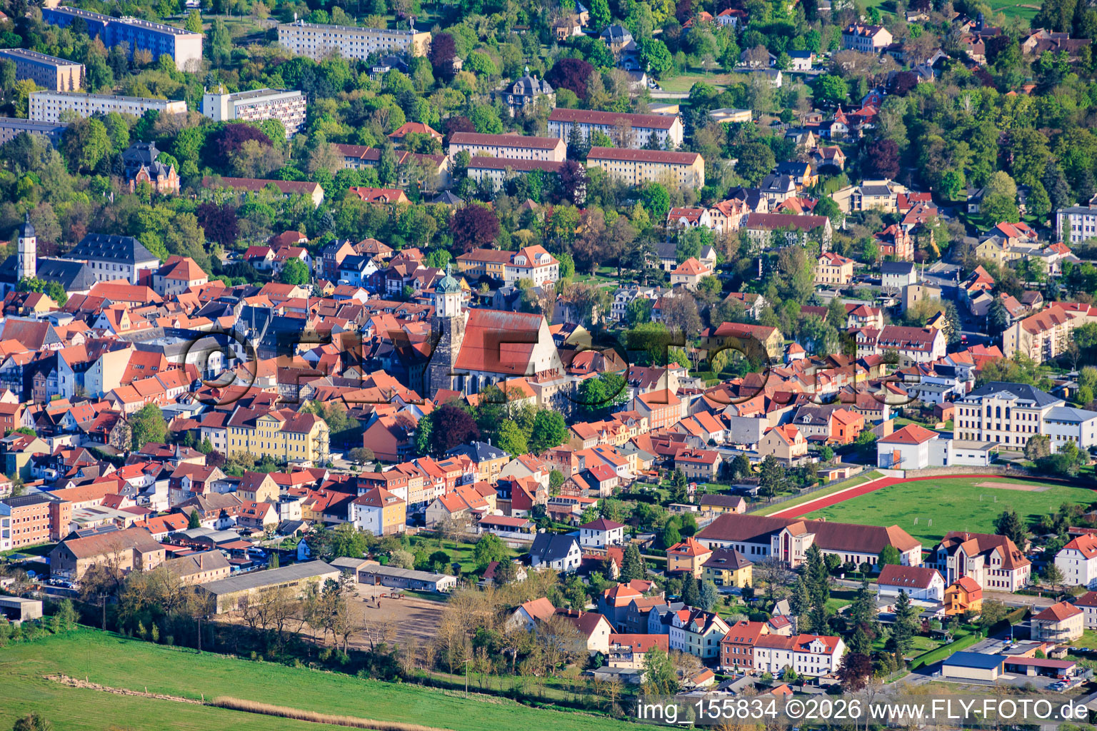 City view from the north with church square and the city church of St. John the Baptist as well as Goethe Stadium in Neustadt an der Orla in the state Thuringia, Germany
