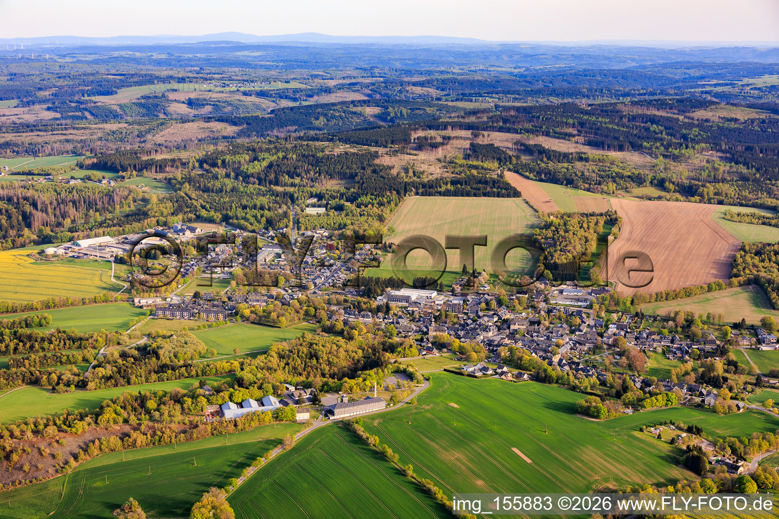 Village view from the north with the Frankenwald agricultural cooperative. in Lehesten in the state Thuringia, Germany
