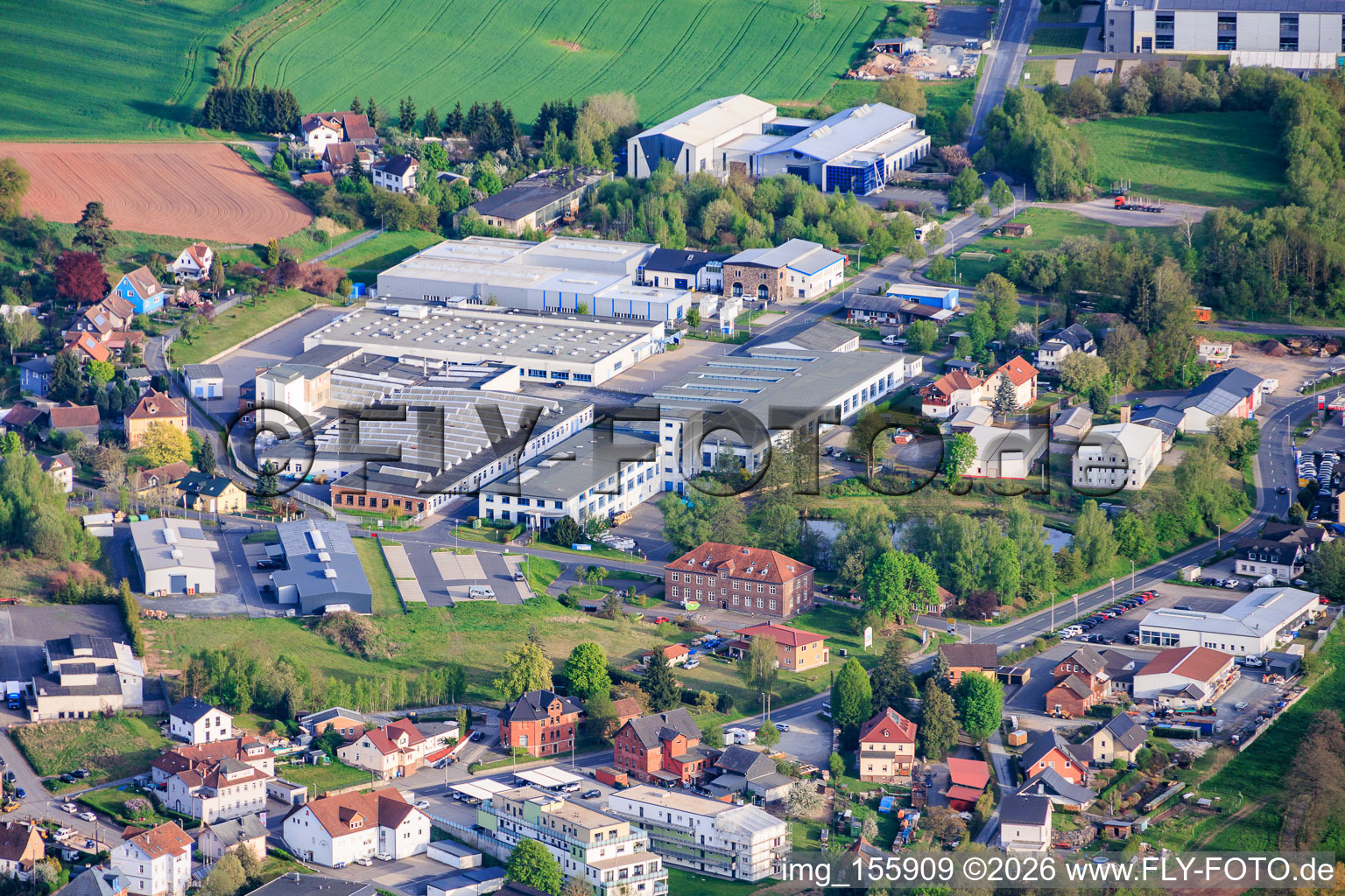 Industrial area Industriestraße with Federal-Mogul Ignition GmbH, Elektromaschinenbau Schultheiß & Co. GmbH and Zirbs Verpackungen e.Kfr in the district Neuhaus in Föritztal in the state Thuringia, Germany
