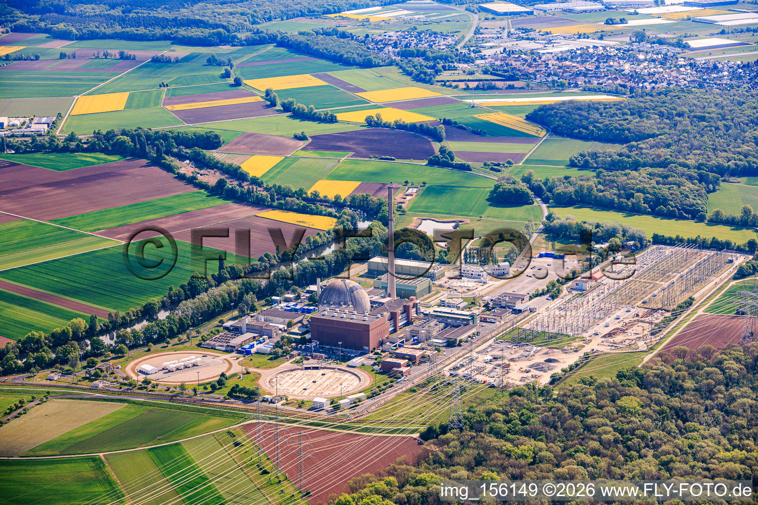 Decommissioned nuclear power plant Grafenrheinfeld of Preussenelektra GmbH on the banks of the Main River with Castor storage in the "gymnasium" and large substation in Grafenrheinfeld in the state Bavaria, Germany
