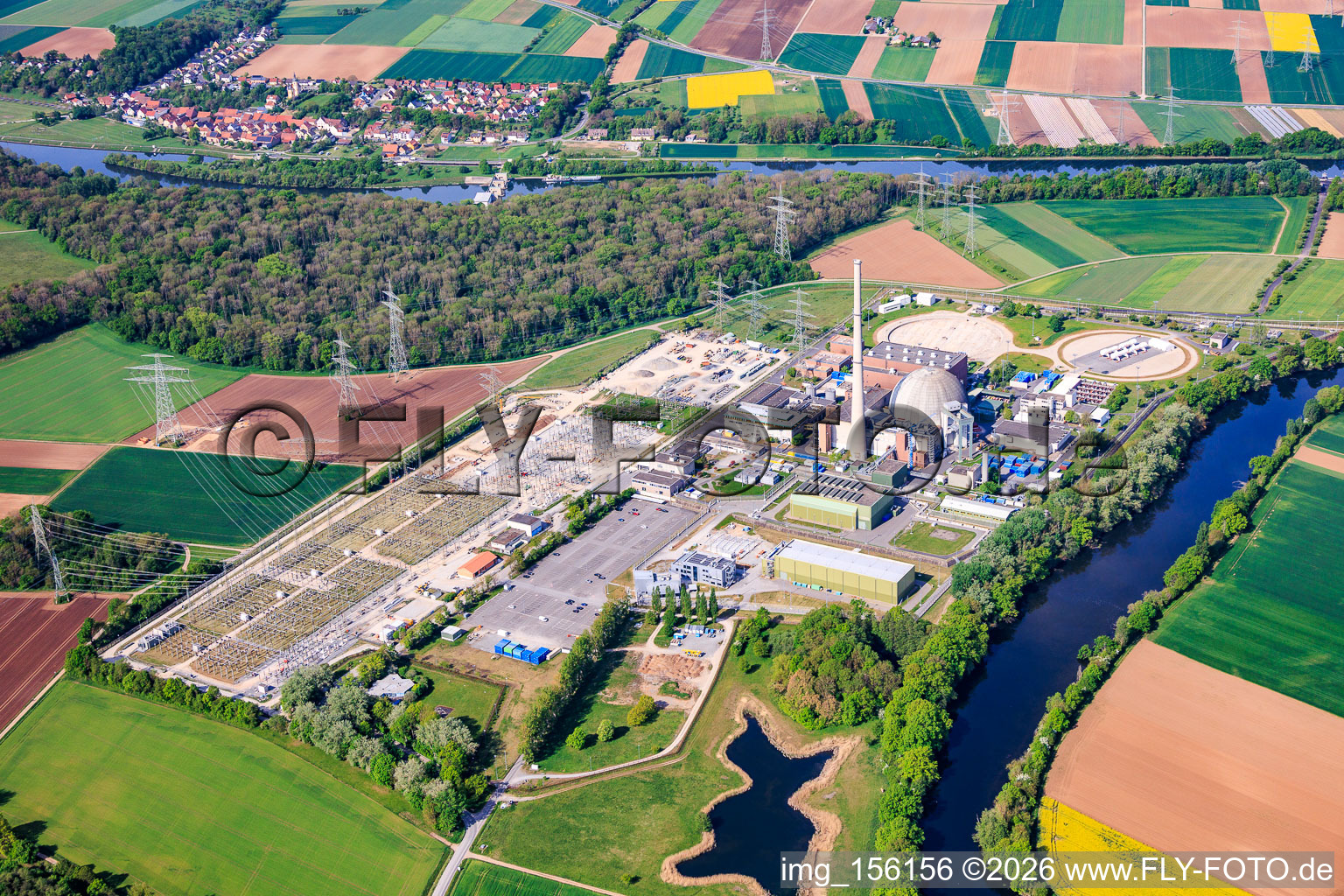 Decommissioned nuclear power plant Grafenrheinfeld of Preussenelektra GmbH on the banks of the Main River with Castor storage in the "gymnasium" and large substation in Grafenrheinfeld in the state Bavaria, Germany