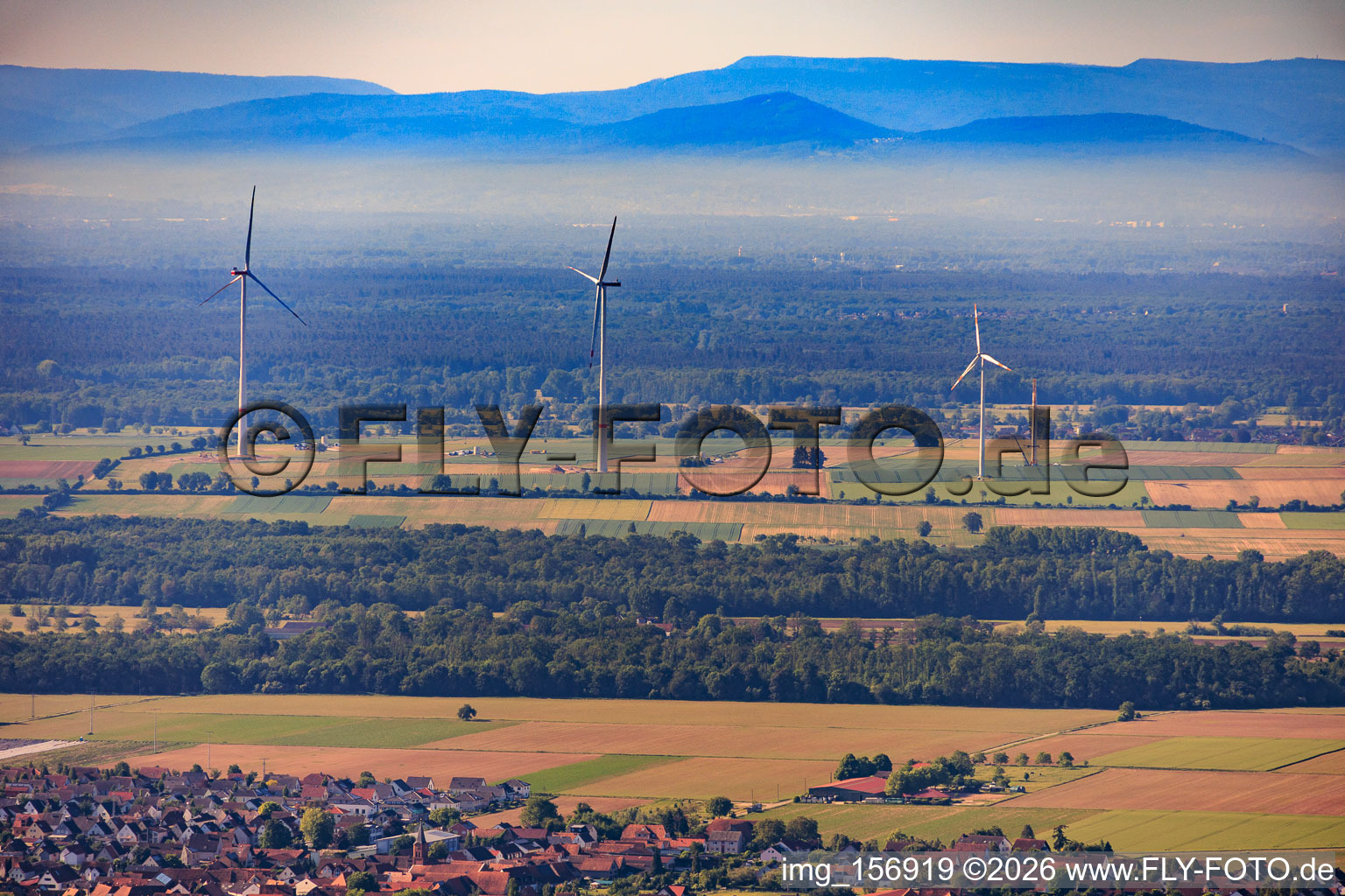 Demolition of the four old turbines (GE 1.5) from 2004 after repowering of the wind farm Minfeld from the north in Minfeld in the state Rhineland-Palatinate, Germany