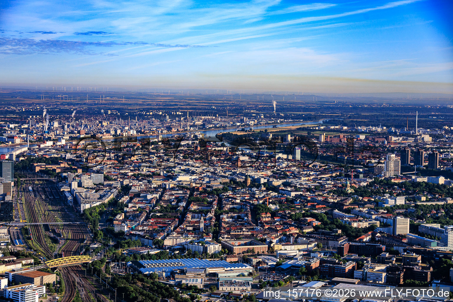 City overview from the southeast, from the yellow bridge of the Neckarau crossing over the railway tracks to BASF on the other side of the Rhine. in the district Innenstadt in Mannheim in the state Baden-Wuerttemberg, Germany