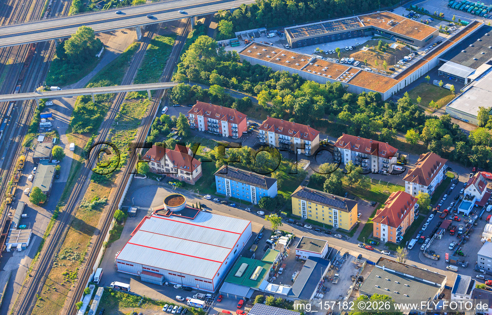 Residential developments and Pepperl+Fuchs Vertrieb Deutschland GmbH in Franz-Grashof-Straße from the west in the district Neckarau in Mannheim in the state Baden-Wuerttemberg, Germany