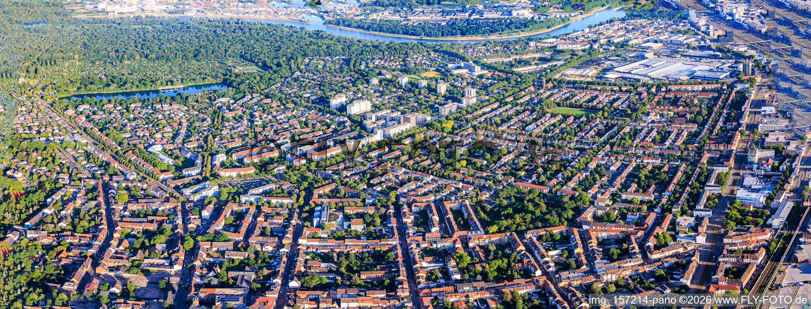 Panorama of the district from the east to the Stollenwörthweiher pond and the park island across the Rhine. in the district Almenhof in Mannheim in the state Baden-Wuerttemberg, Germany