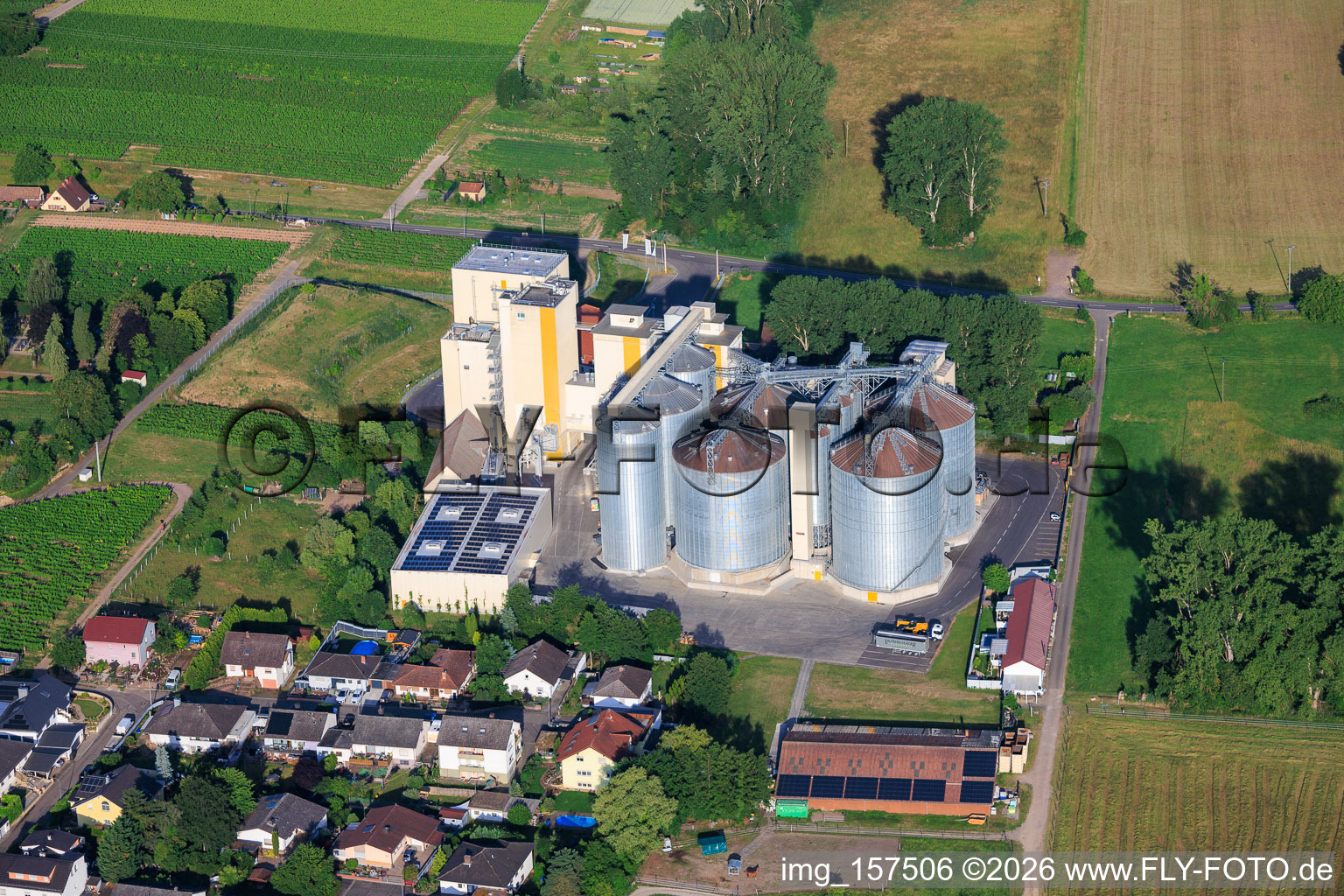 Silos and production buildings of the Cornexo GmbH mill from the northeast in Freimersheim in the state Rhineland-Palatinate, Germany