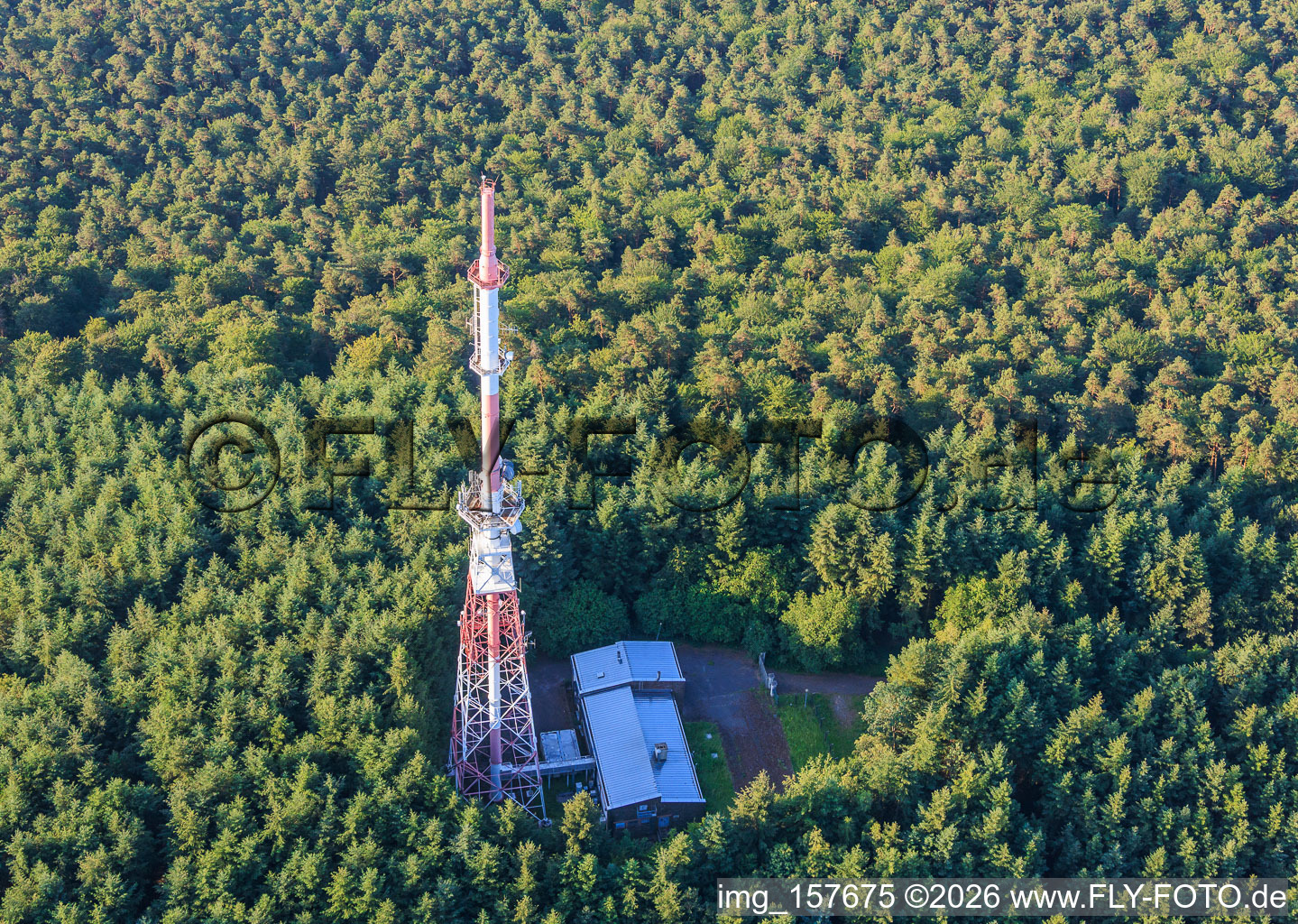 Red and white transmission tower at the Col du Pigeonnier in Wissembourg in the state Bas-Rhin, France
