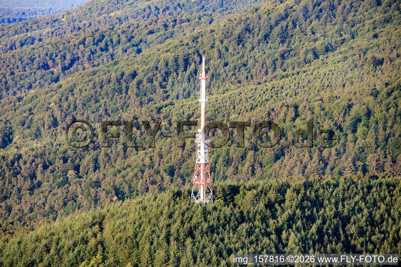 Red and white transmission tower at the Col du Pigeonnier in Wissembourg in the state Bas-Rhin, France