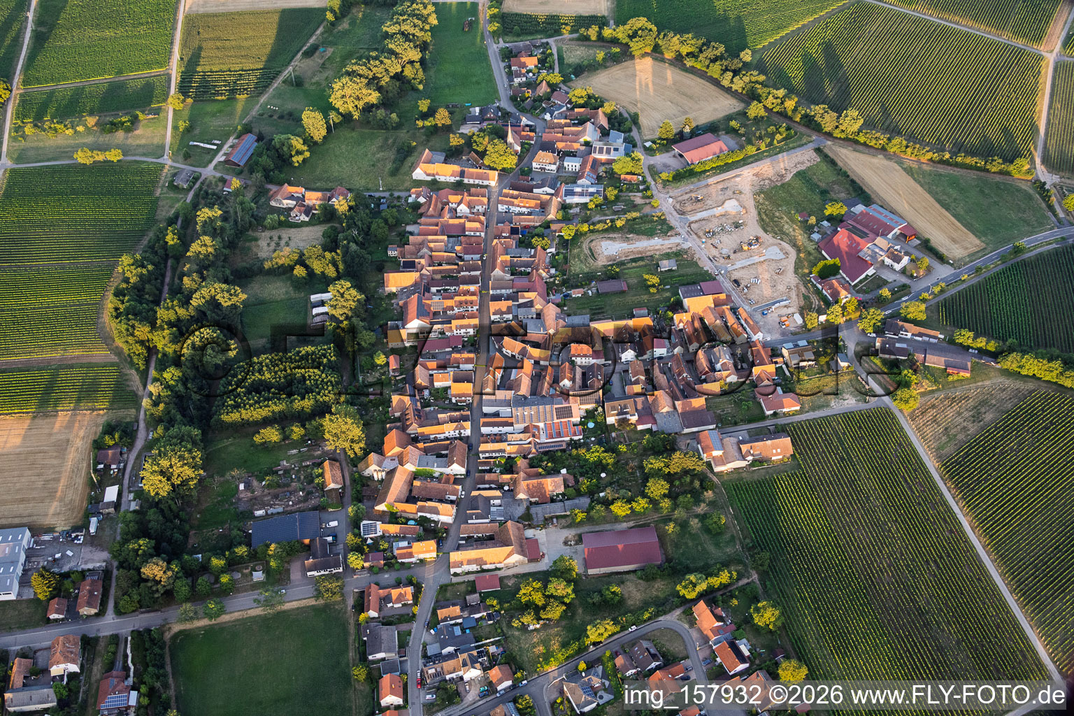Village view from the west in the evening with new housing development at the Lindenhof winery in the district Klingen in Heuchelheim-Klingen in the state Rhineland-Palatinate, Germany