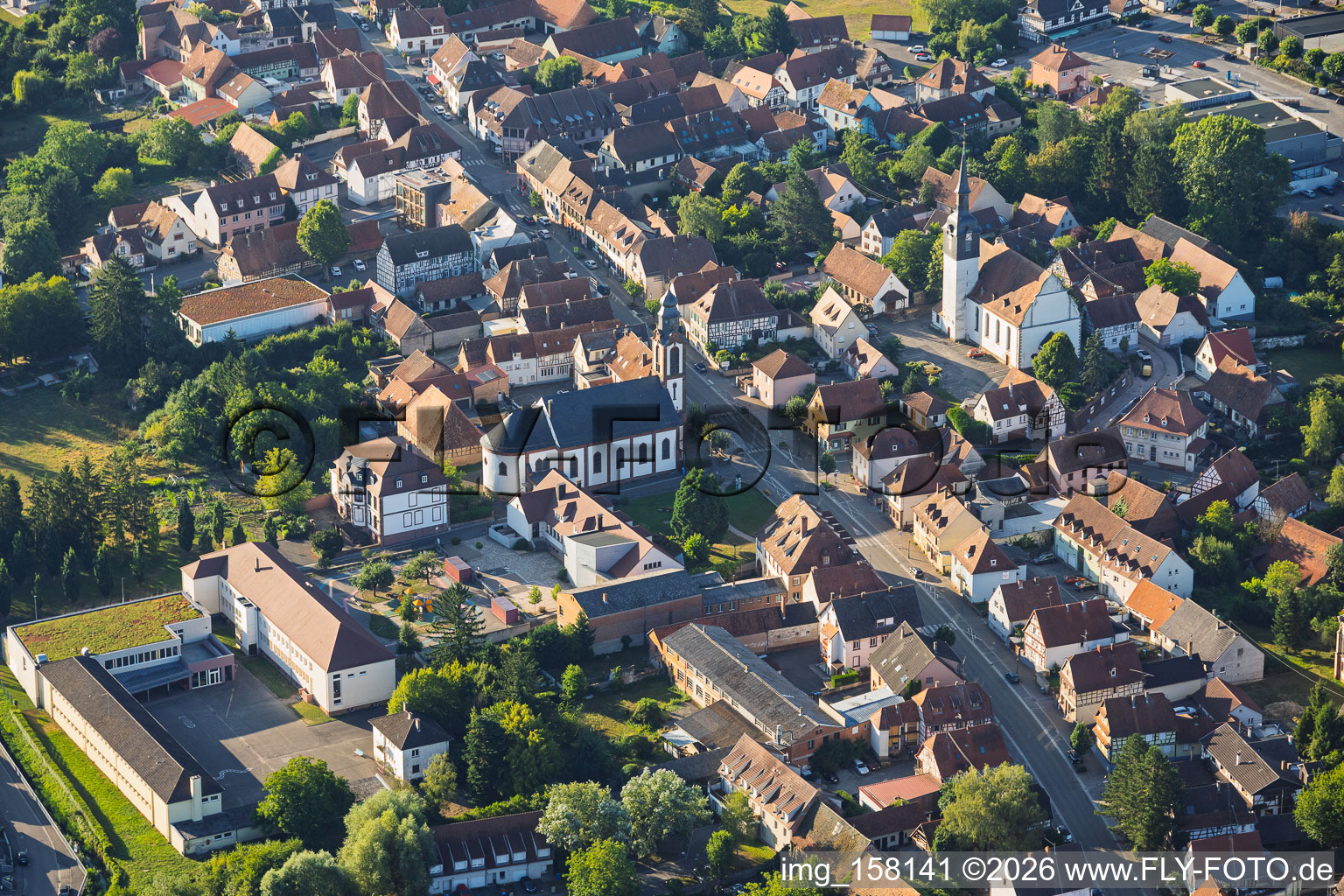 Town hall/primary school, Saint-Pierre-Saint-Paul Church, and Protestant Church of Soultz-sous-Forêts in Soultz-sous-Forêts in the state Bas-Rhin, France