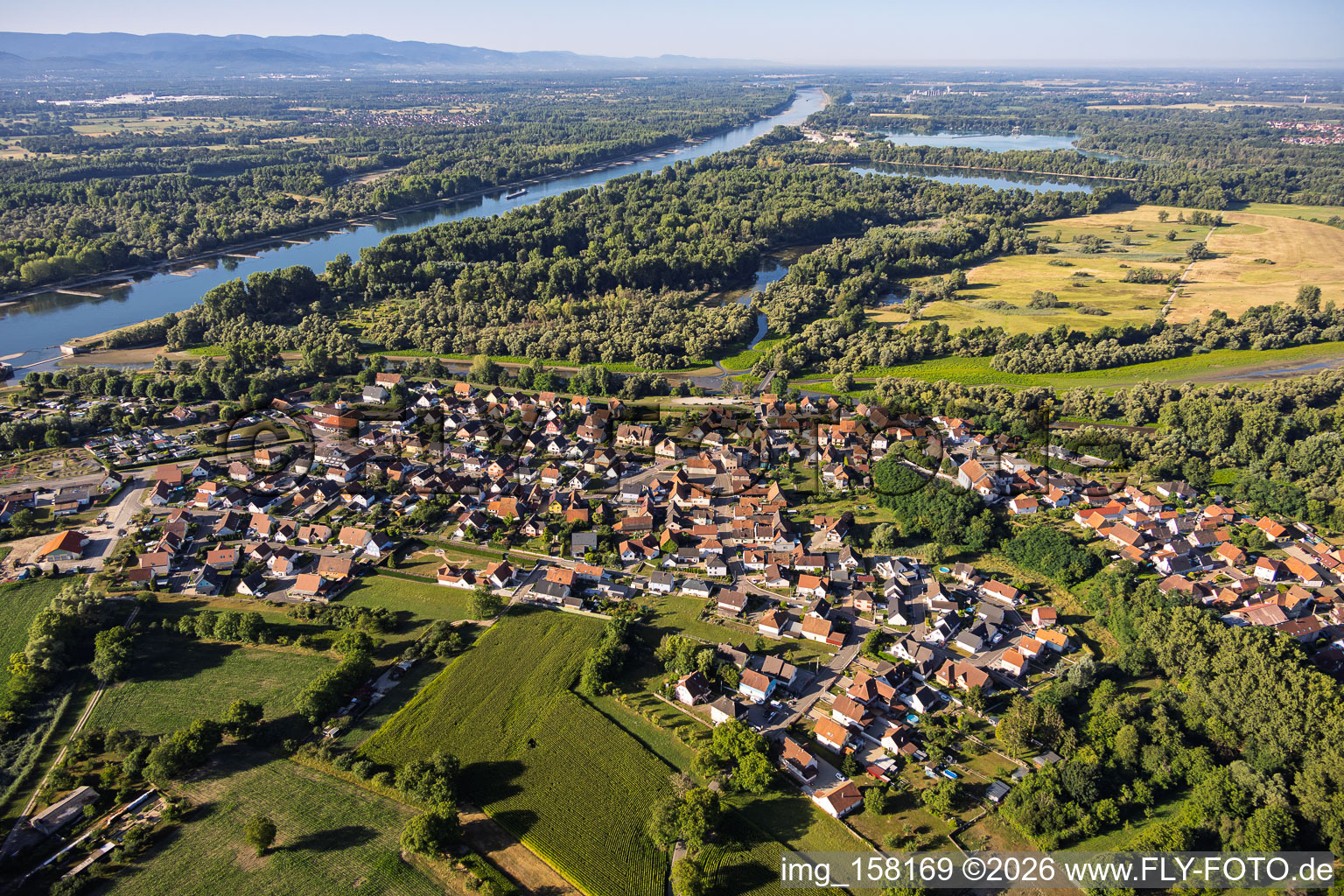 Village view from the northwest at the mouth of the Sauer into the Rhine in Munchhausen in the state Bas-Rhin, France