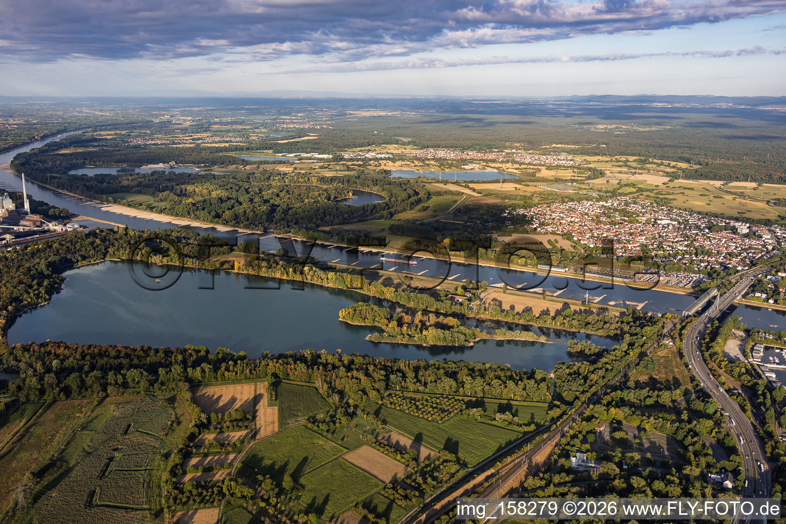 Low water on the Rhine between the Rhine bridges and the power plant beyond Knielinger See in the district Knielingen in Karlsruhe in the state Baden-Wuerttemberg, Germany