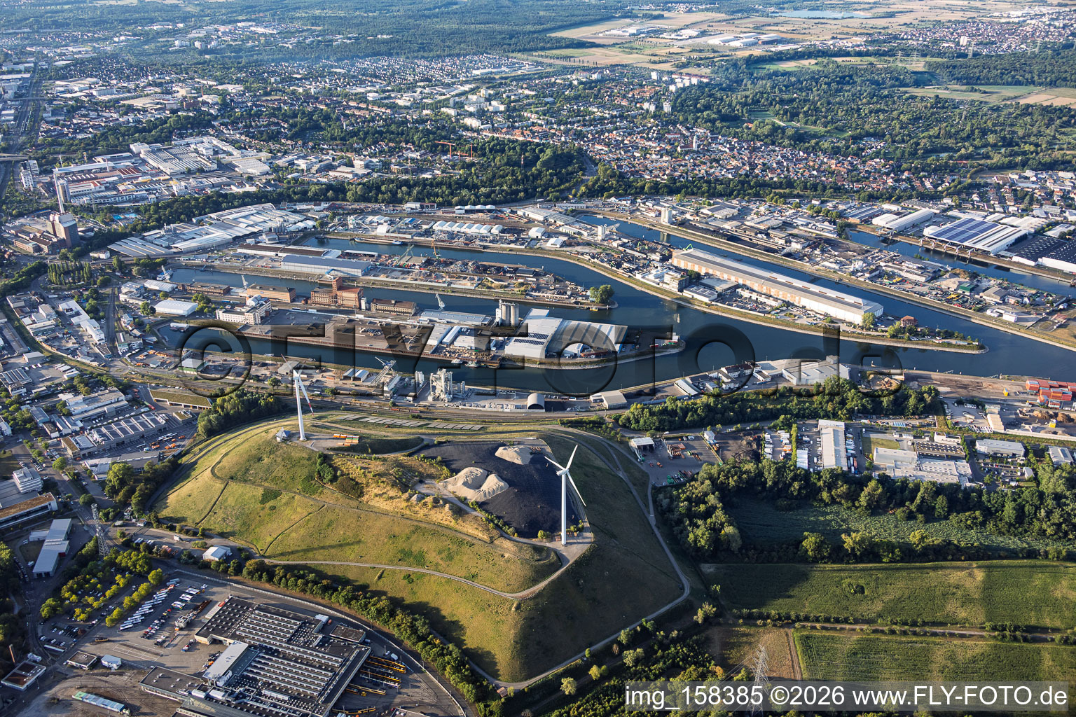 Rhine ports Karlsruhe beyond the West Landfill ("Energieberg") with two wind turbines in the district Knielingen in Karlsruhe in the state Baden-Wuerttemberg, Germany