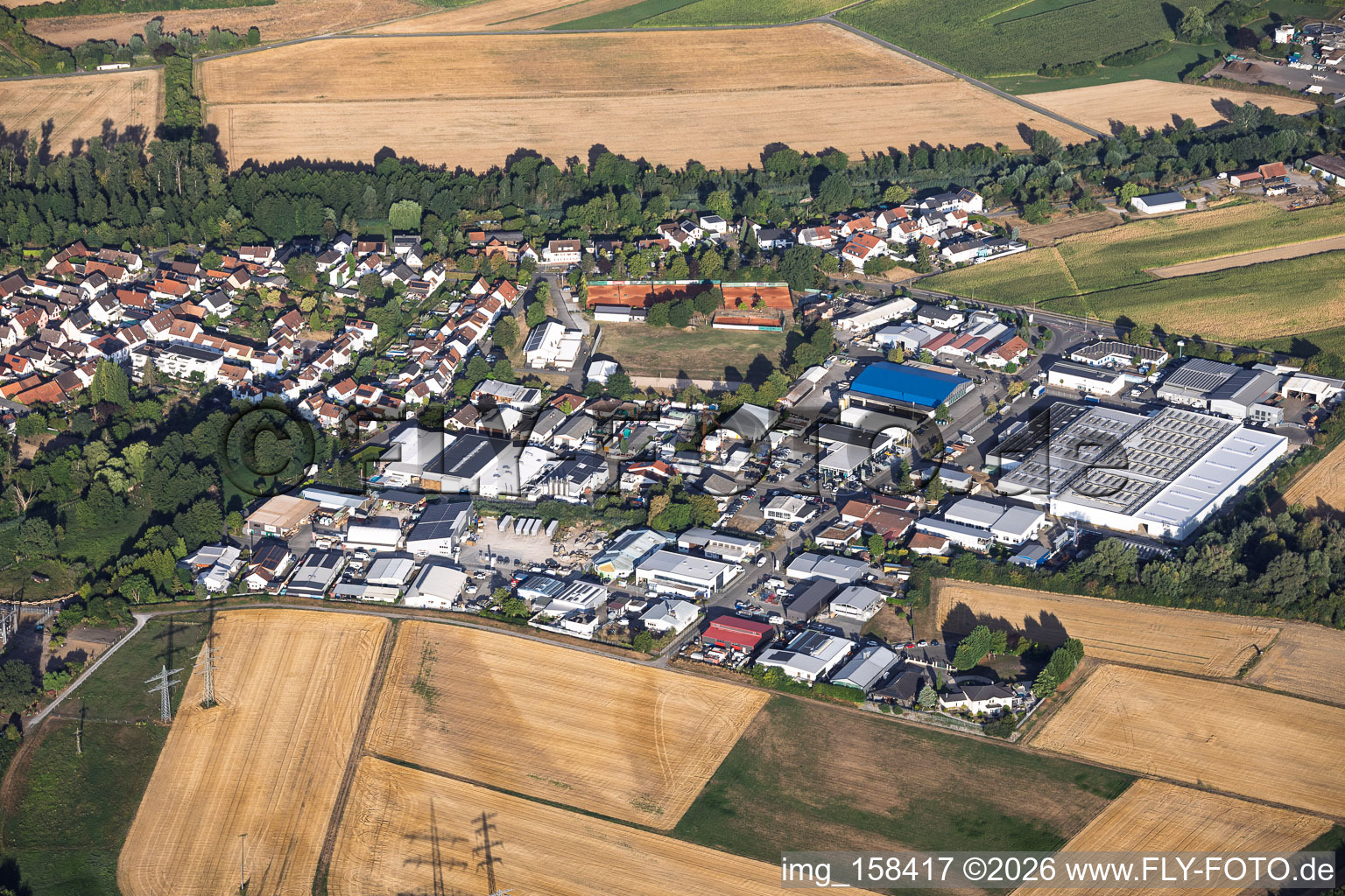 Gewerbering (industrial zone) from the east, featuring Hans Höffele Industriewatte GmbH and the indoor tennis center in the district Hochstetten in Linkenheim-Hochstetten in the state Baden-Wuerttemberg, Germany