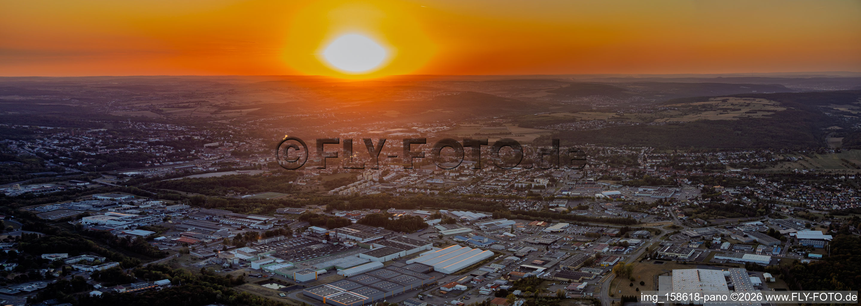 Sunset over the industrial area in the district Zone Industrielle du Grand Bois Fayencerie in Saargemünd in the state Moselle, France