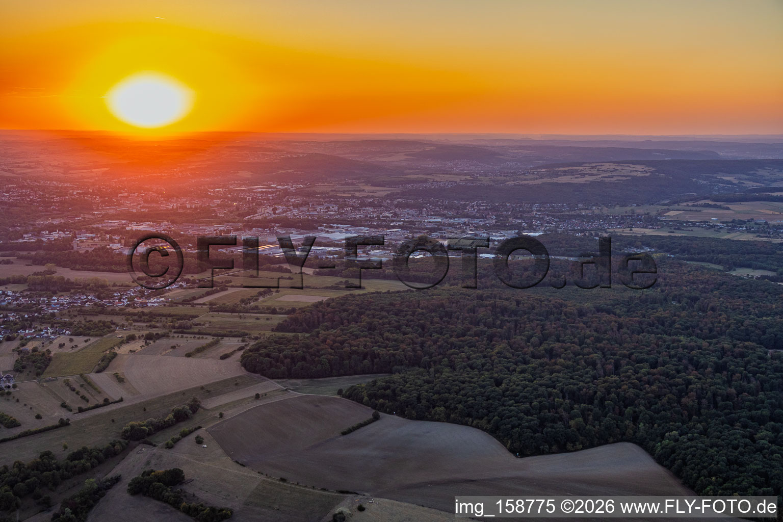 Sunset over the industrial area in the district Zone Industrielle du Grand Bois Fayencerie in Saargemünd in the state Moselle, France