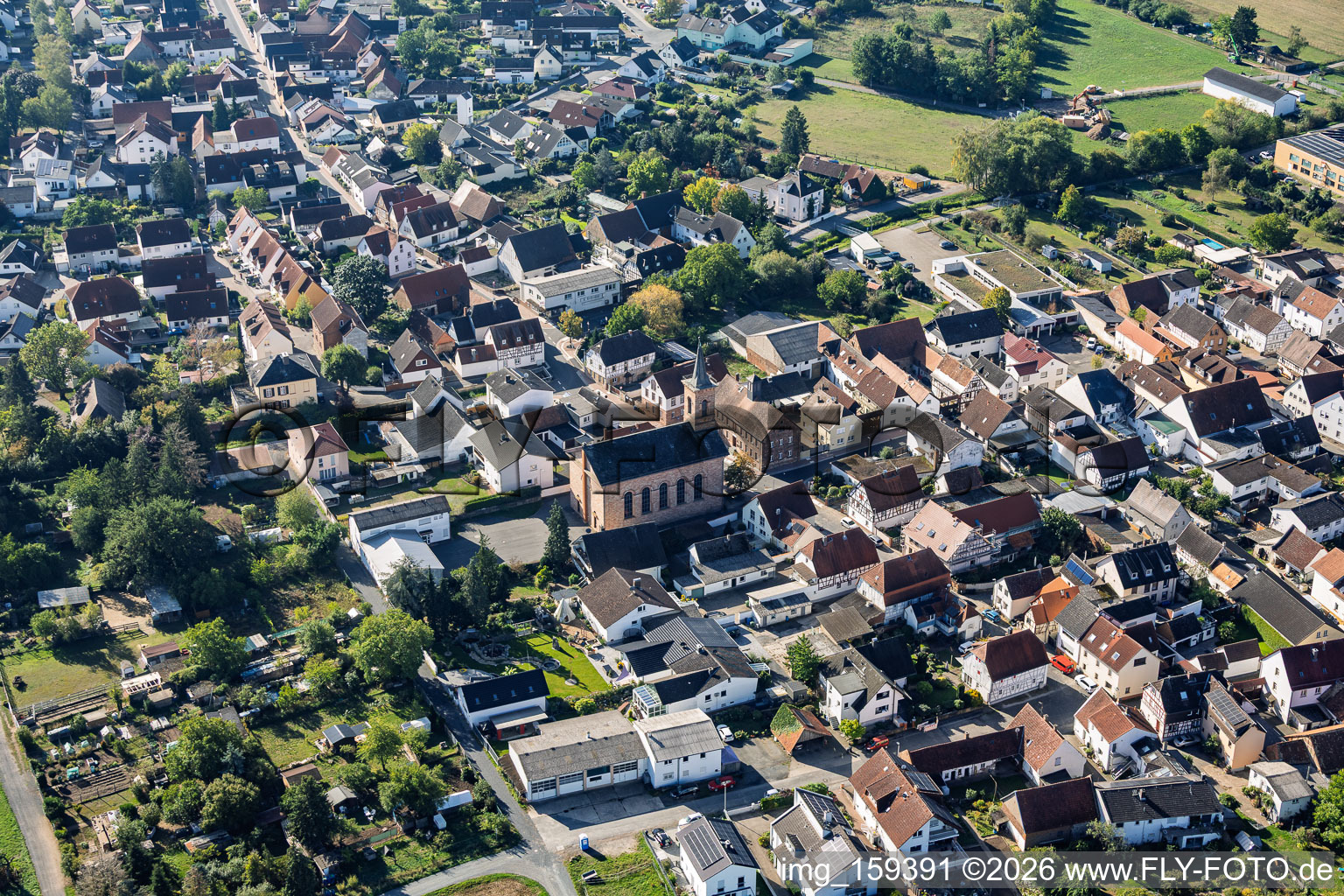 Ernst-Ludwig-Straße with Protestant Church Sickenhofen in the district Sickenhofen in Babenhausen in the state Hesse, Germany