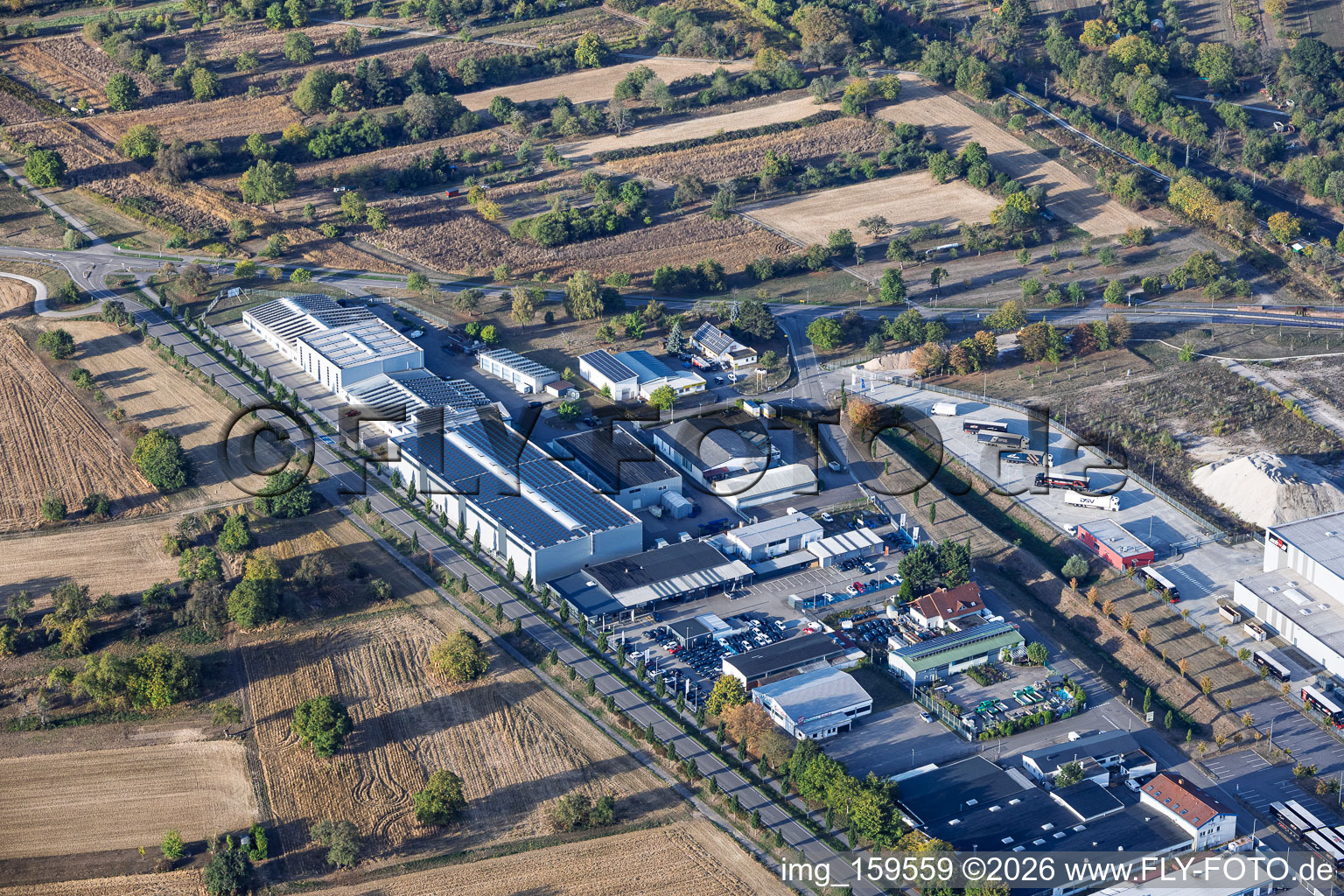 Industriestraße industrial area with Autohaus Kühn (Seat), Götz Maschinenbau GmbH & Co. KG, and Logistik Schmitt (PCC site Ötigheim) in Ötigheim in the state Baden-Wuerttemberg, Germany