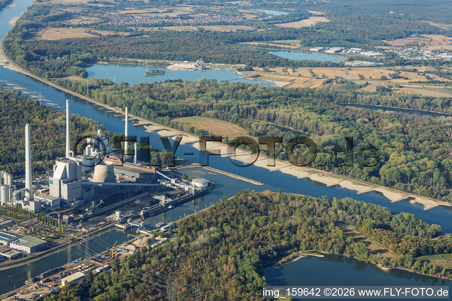 Mouth of the harbor into the Rhine at the Karlsruhe Rhine Port steam power plant (view from the east at low water) in the district Maximiliansau in Wörth am Rhein in the state Rhineland-Palatinate, Germany