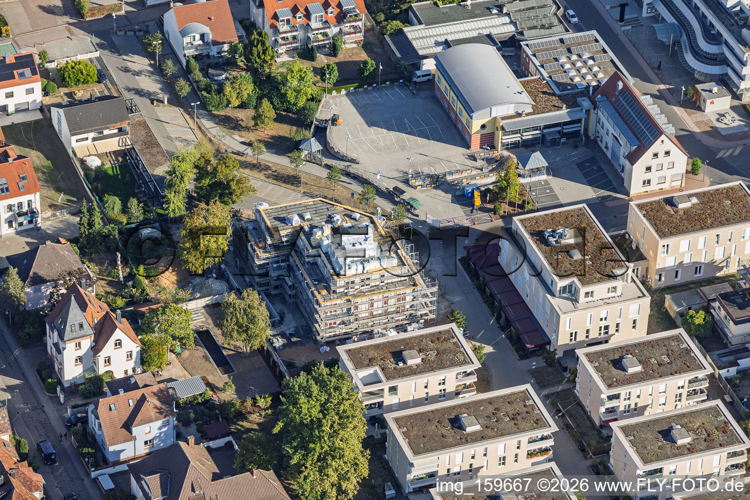 New construction site for 18 condominiums in the town center of Grathwohl. Earthworks, ETNA BAU GmbH and Abbruch GmbH and AK.Bau GmbH. https:// in Kandel in the state Rhineland-Palatinate, Germany