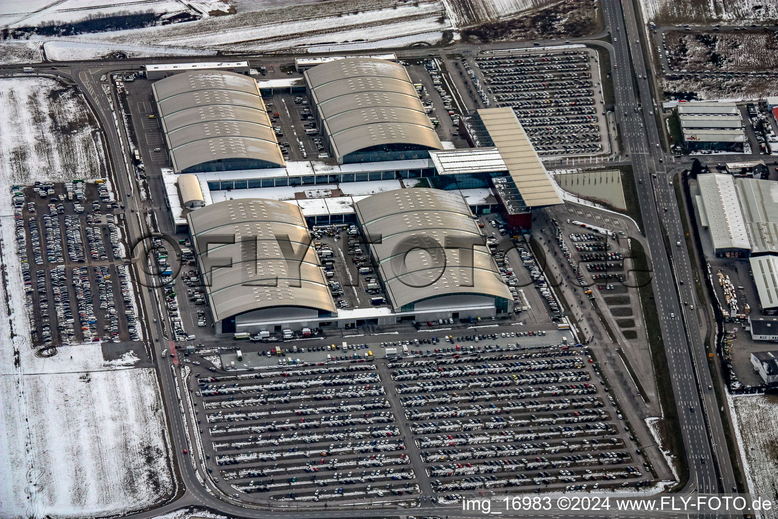 Wintry snowy Exhibition grounds and exhibition halls of the DM-Arena Karlsruher Messe- and Kongress GmbH in the district Forchheim in Rheinstetten in the state Baden-Wurttemberg, Germany