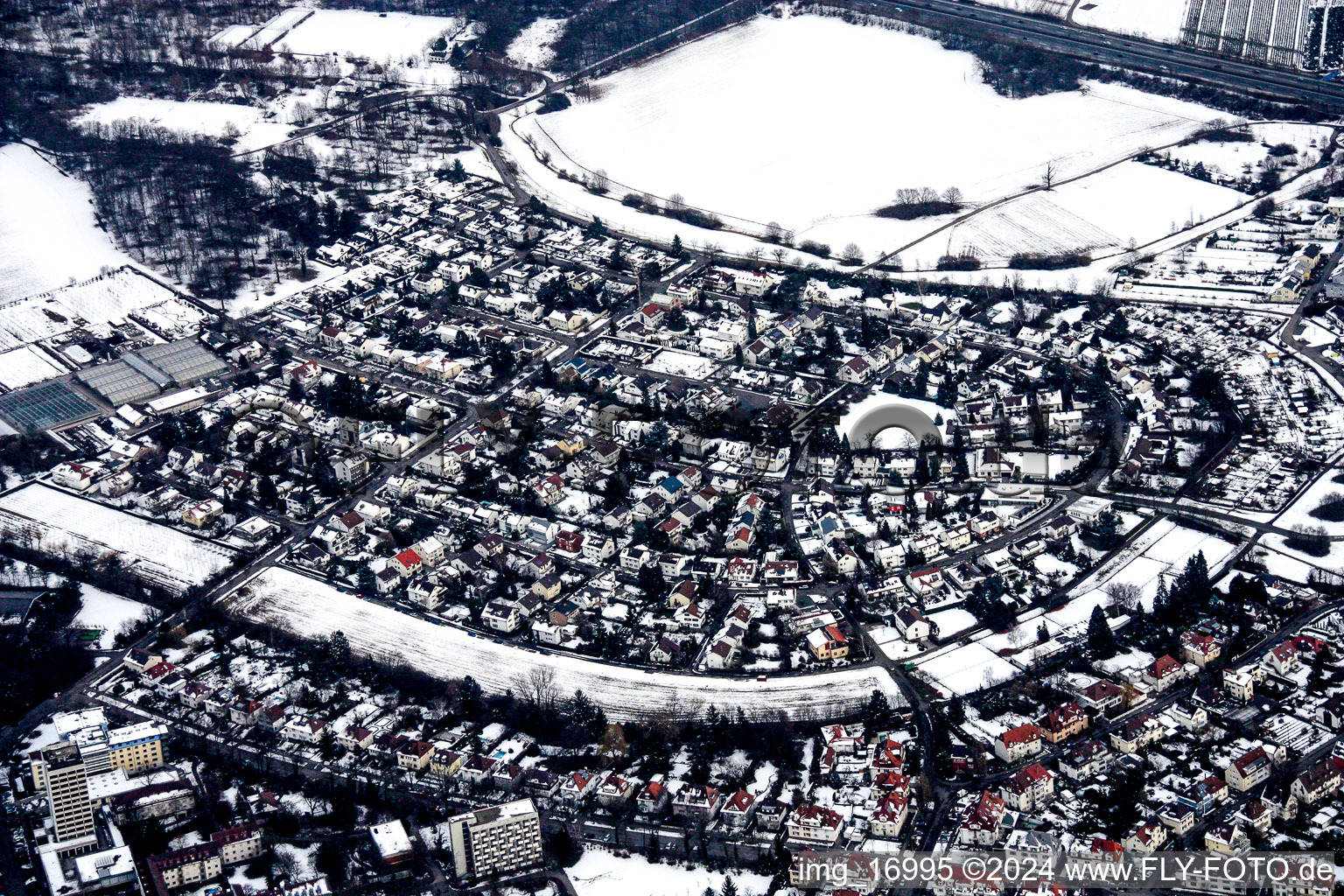 Wintry snowy Residential area of the multi-family house settlement Maerchenring in the district Rueppurr in Karlsruhe in the state Baden-Wurttemberg, Germany