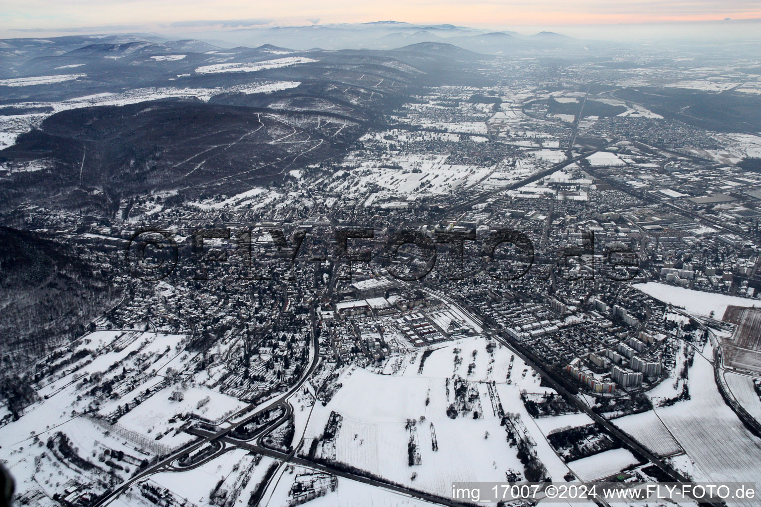 Aerial photograpy of Wintry snowy Town View of the streets and houses of the residential areas in Ettlingen in the state Baden-Wurttemberg