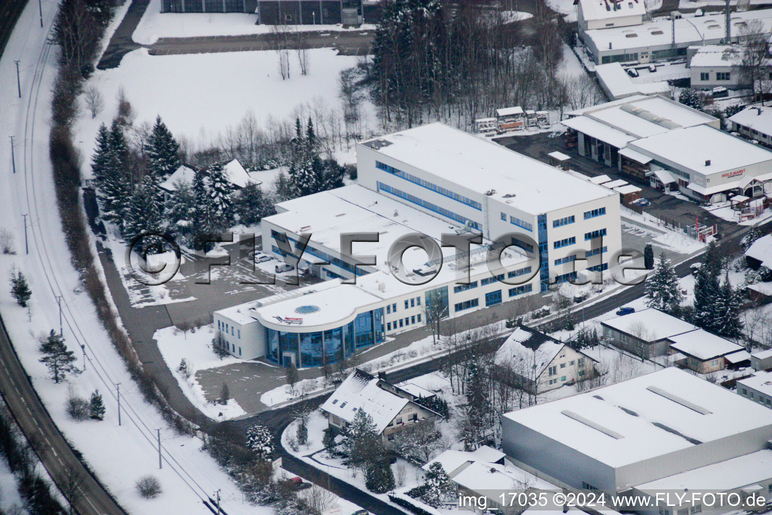 Aerial view of Wintry snowy Industrial and commercial area in the district Ittersbach in Karlsbad in the state Baden-Wurttemberg