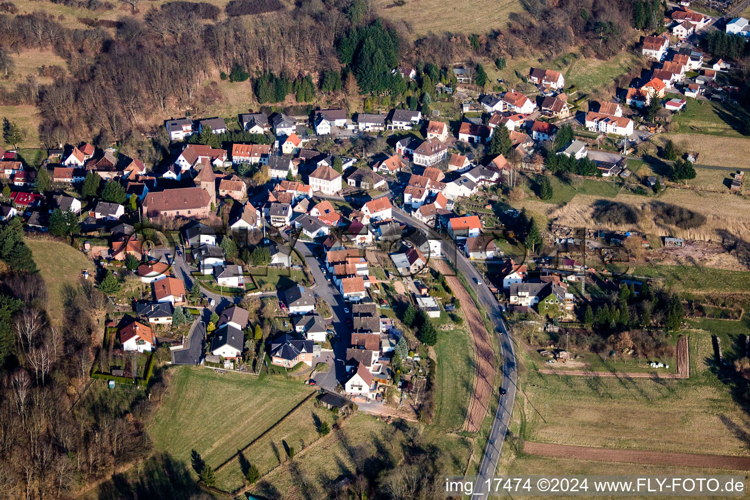 Village - view on the edge of agricultural fields and farmland in Niederschlettenbach in the state Rhineland-Palatinate, Germany