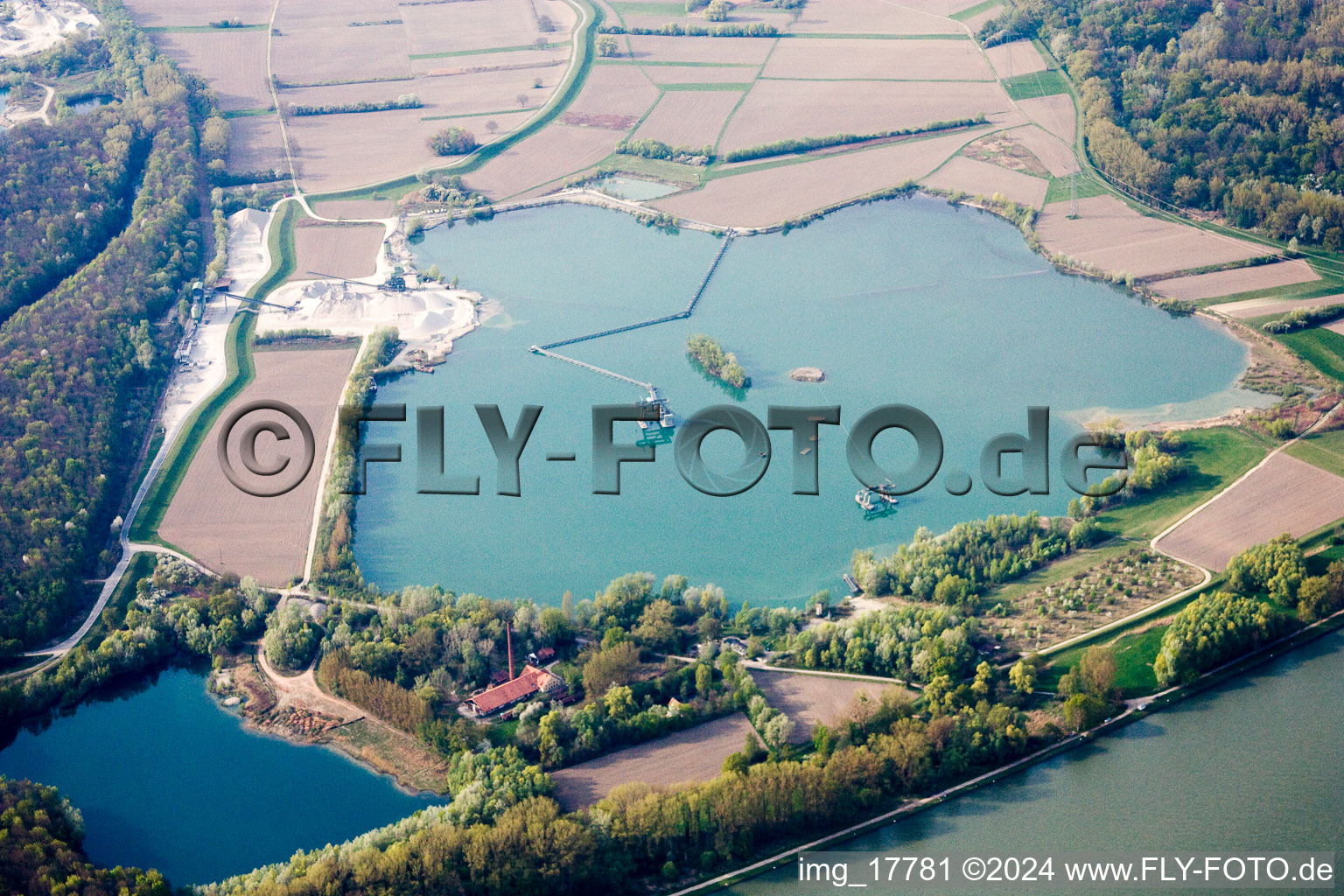 Quarry lake in the district Neuburg in Neuburg am Rhein in the state Rhineland-Palatinate, Germany