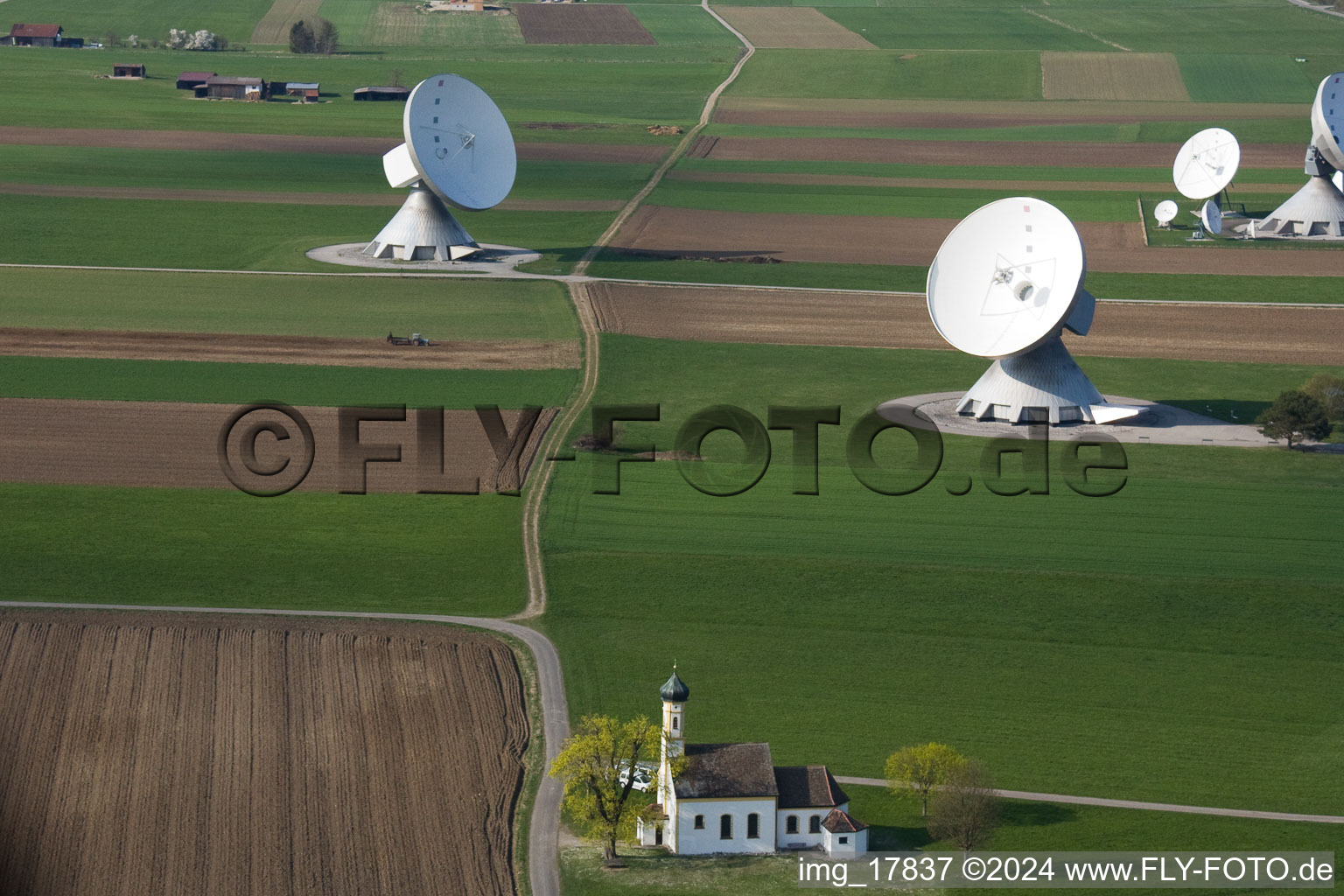 Oblique view of Earth station with chapel in Raisting in the state Bavaria, Germany