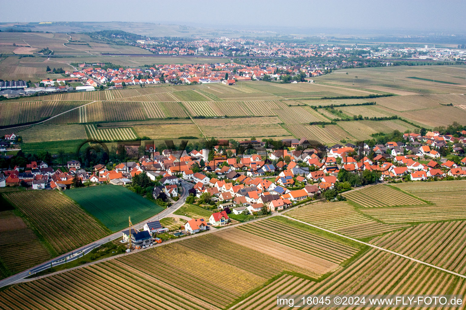 Village - view on the edge of agricultural fields and farmland in Kleinkarlbach in the state Rhineland-Palatinate, Germany