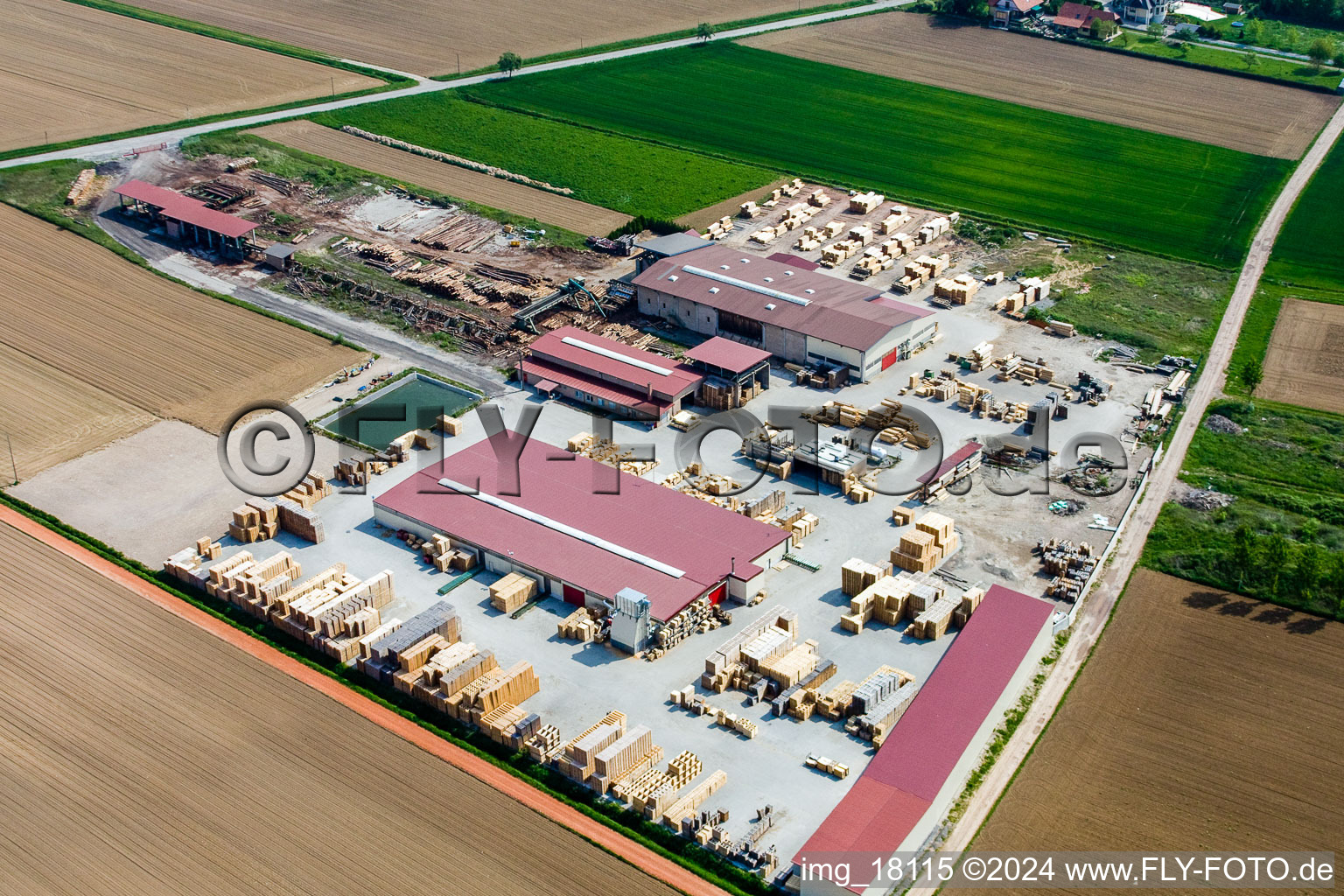 Aerial view of Building and production halls on the premises of sawery and Palett-Maker KOCHER in NiederrA?dern in Grand Est, France