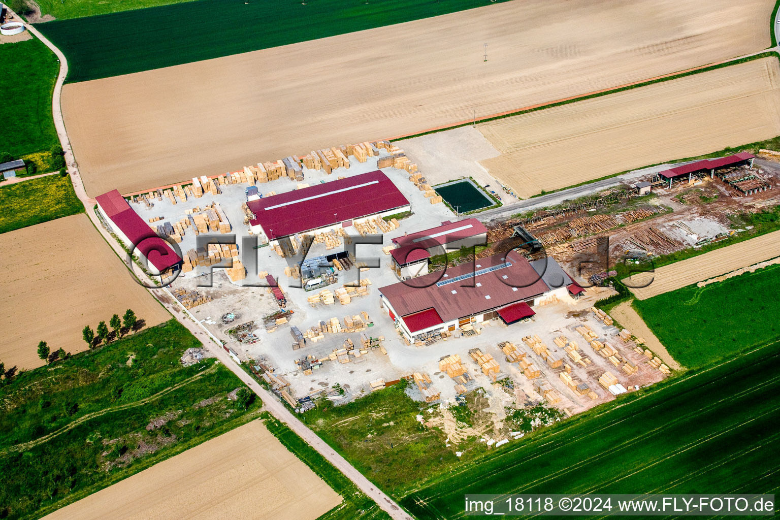 Aerial photograpy of Building and production halls on the premises of sawery and Palett-Maker KOCHER in NiederrA?dern in Grand Est, France