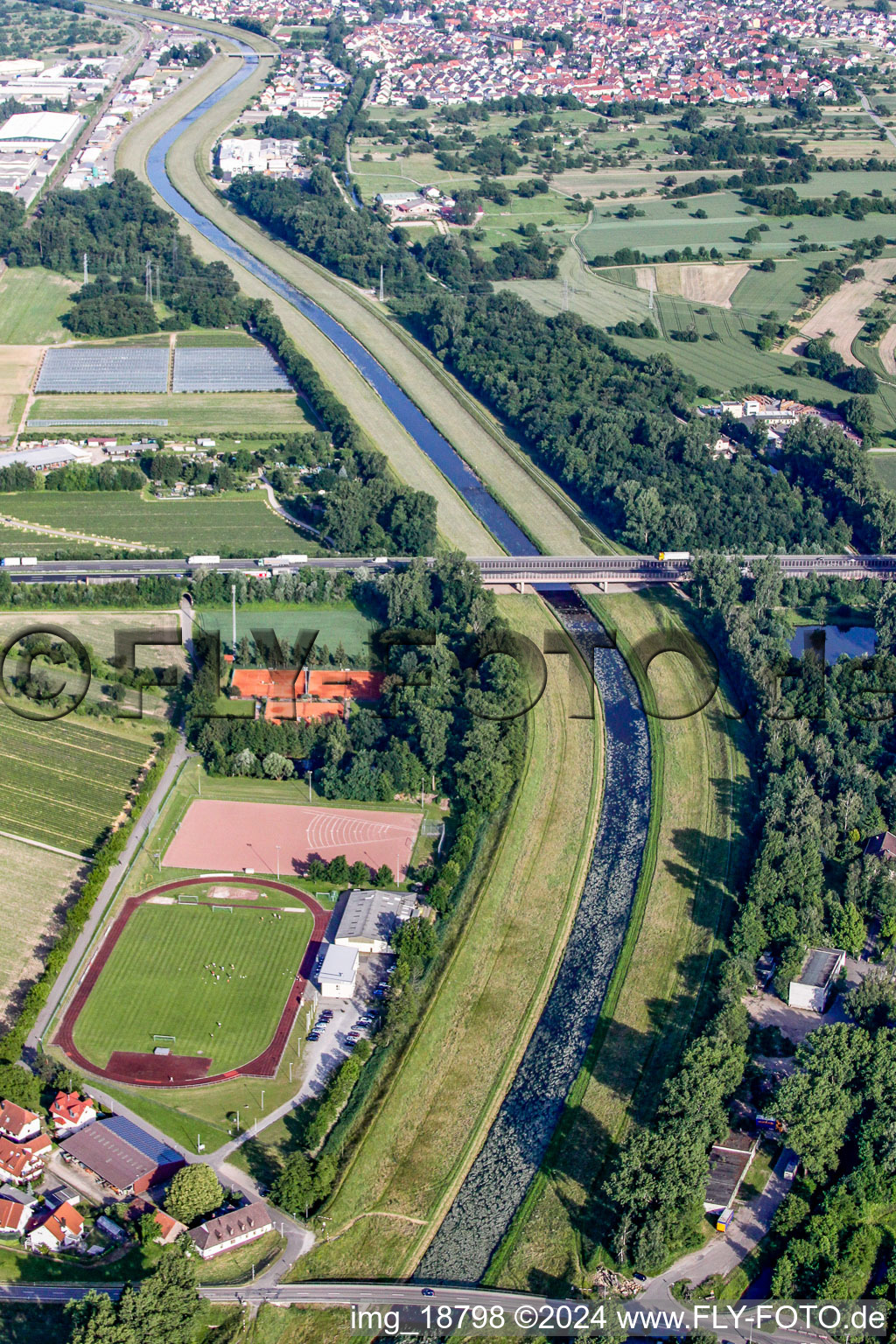 Shore areas of the reinforced by flood protection dam riverbed course of the river Murg in the district Niederbuehl in Rastatt in the state Baden-Wurttemberg, Germany