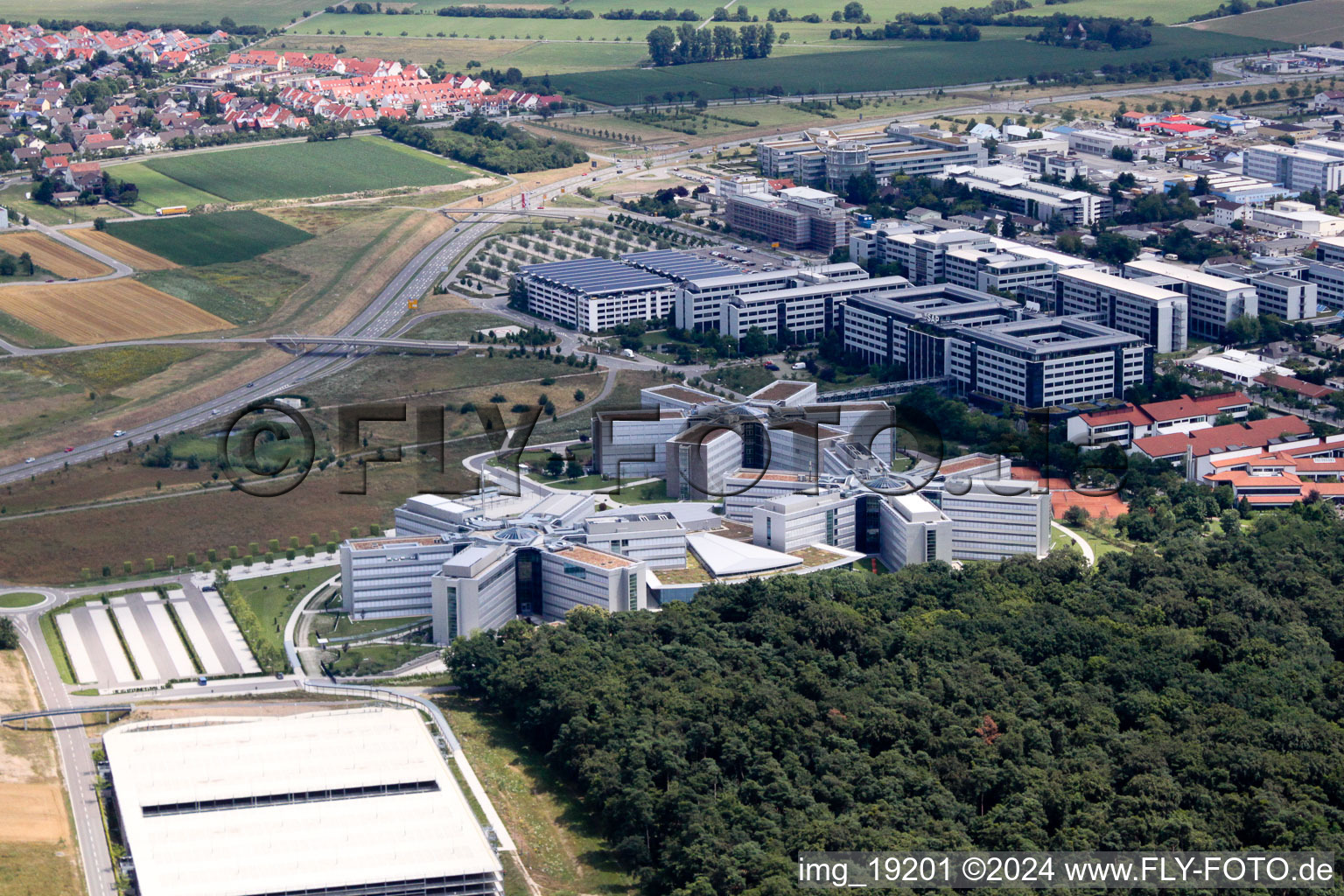 Drone recording of Star-shaped office buildings of the SAP Deutschland SE & Co. KG at the forest edged in Walldorf in the state Baden-Wurttemberg