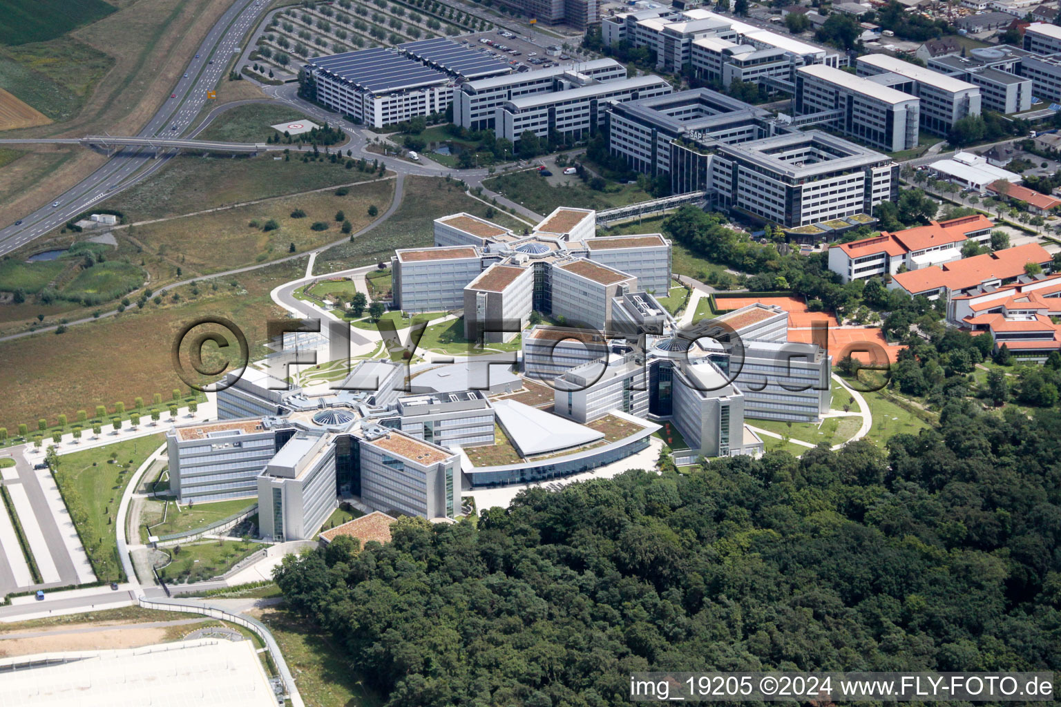 Drone image of Star-shaped office buildings of the SAP Deutschland SE & Co. KG at the forest edged in Walldorf in the state Baden-Wurttemberg