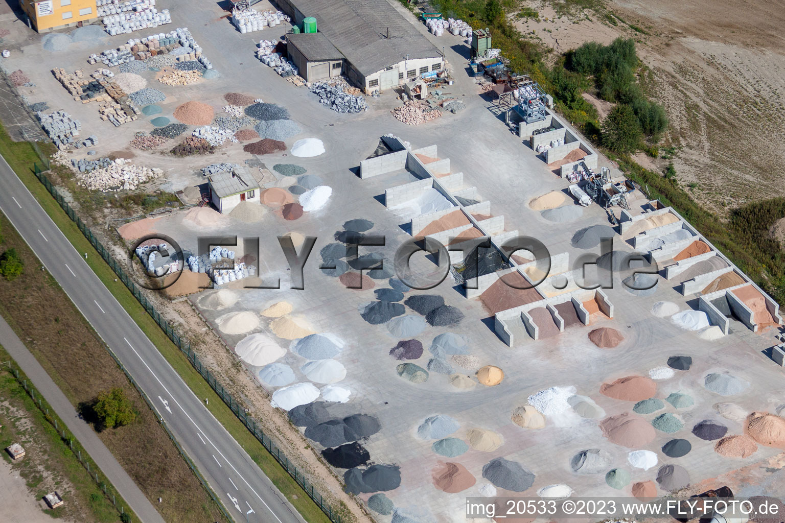 Garden gravel company, Badische Terrazzo Handelsgesellschaft mbH Huttenheimer Landstrasse 2-6 in the district Neudorf in Graben-Neudorf in the state Baden-Wuerttemberg, Germany from the plane